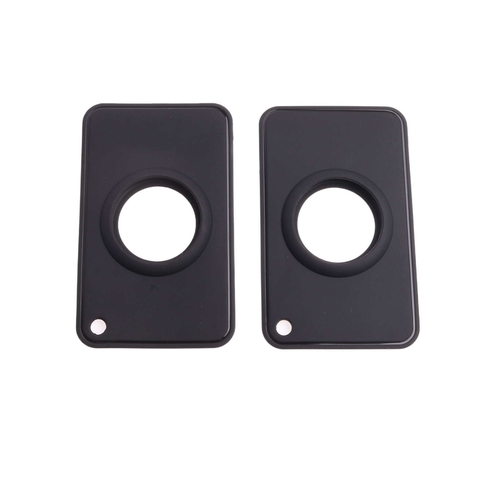 Zwei schwarze rechteckige Platten mit kreisförmigen Aussparungen und kleinen weißen Punkten auf weißem Grund.
