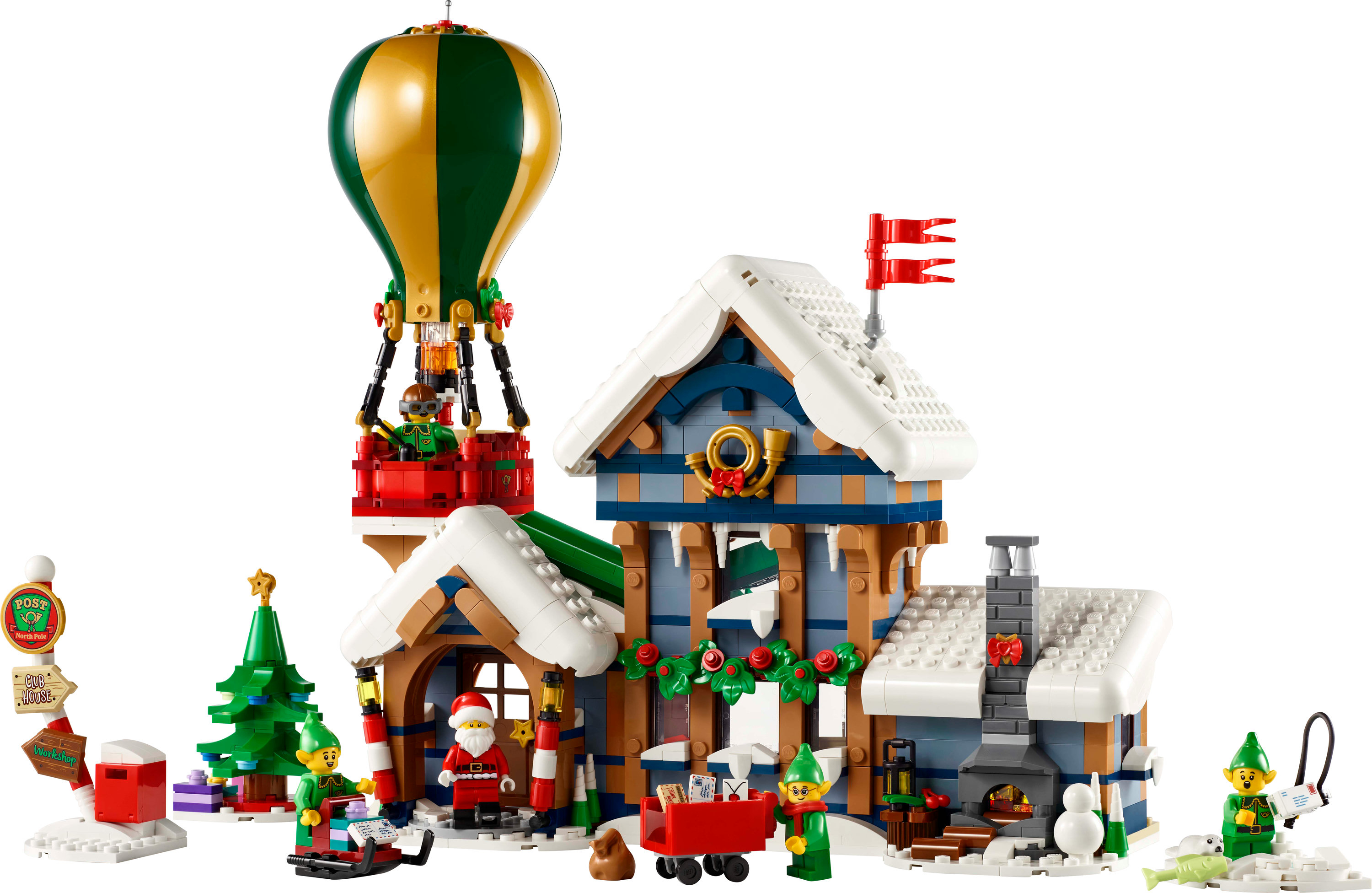 Una scena natalizia Lego con un edificio, Babbo Natale, elfi, mongolfiera e neve. Sono presenti decorazioni festive.