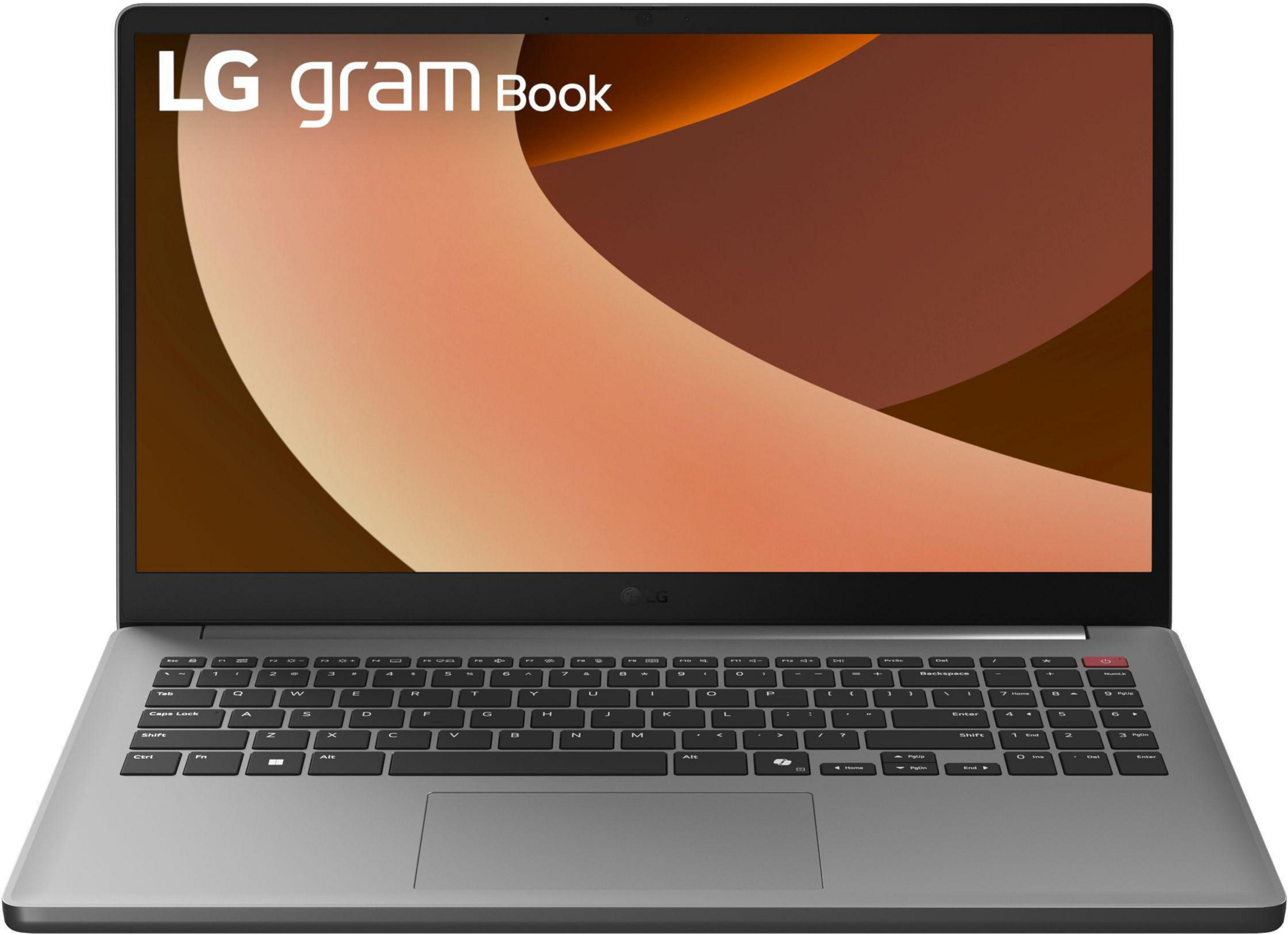 Srebrny laptop LG Gram Book. Ekran wyświetla abstrakcyjne brązowe kształty. Klawiatura jest widoczna.