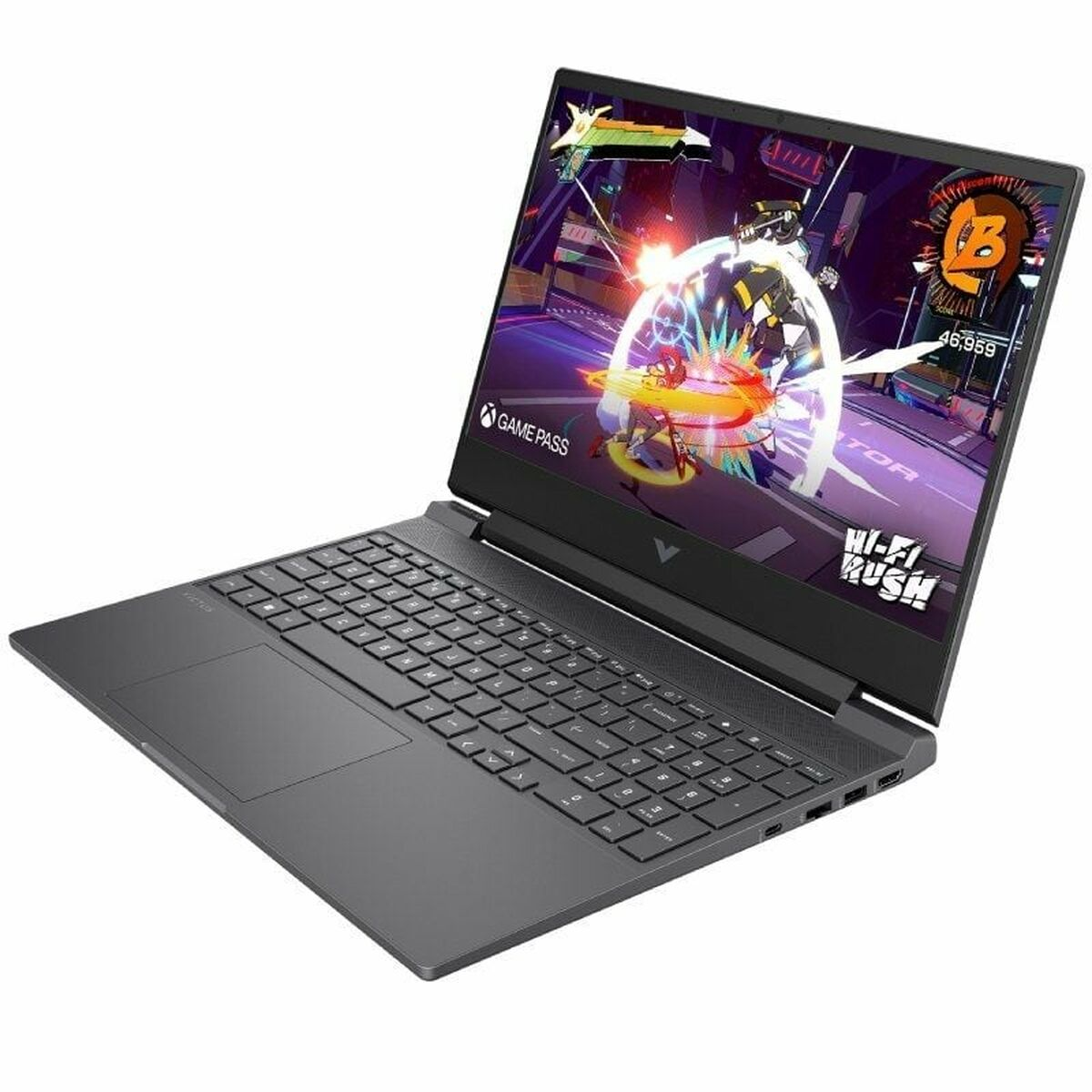 Un portátil negro muestra una escena de videojuego. El teclado es visible en primer plano. La pantalla muestra el juego con personajes.