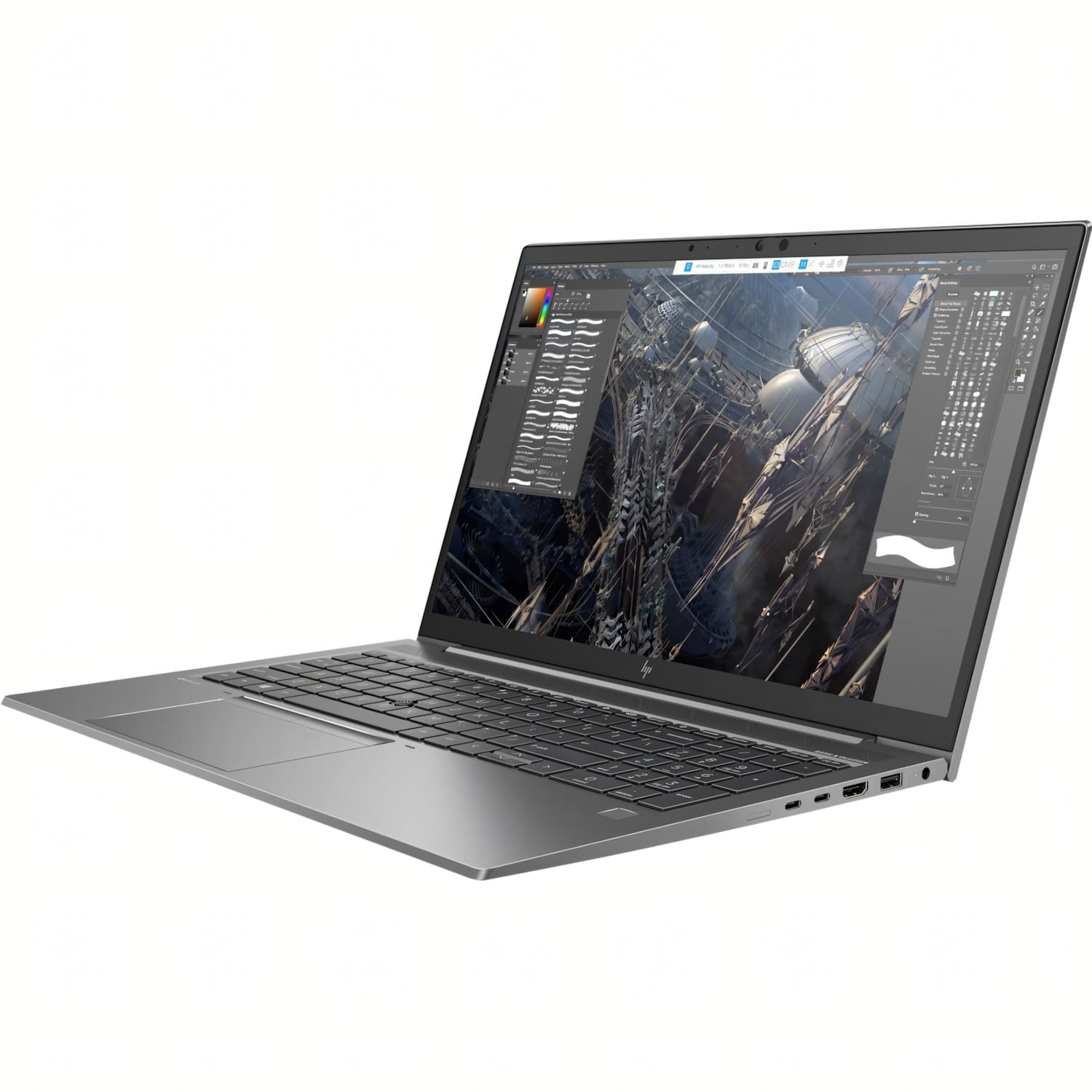 Un portátil plateado está abierto, mostrando una interfaz de software de diseño. La pantalla muestra una representación 3D compleja. Teclado y touchpad son visibles.