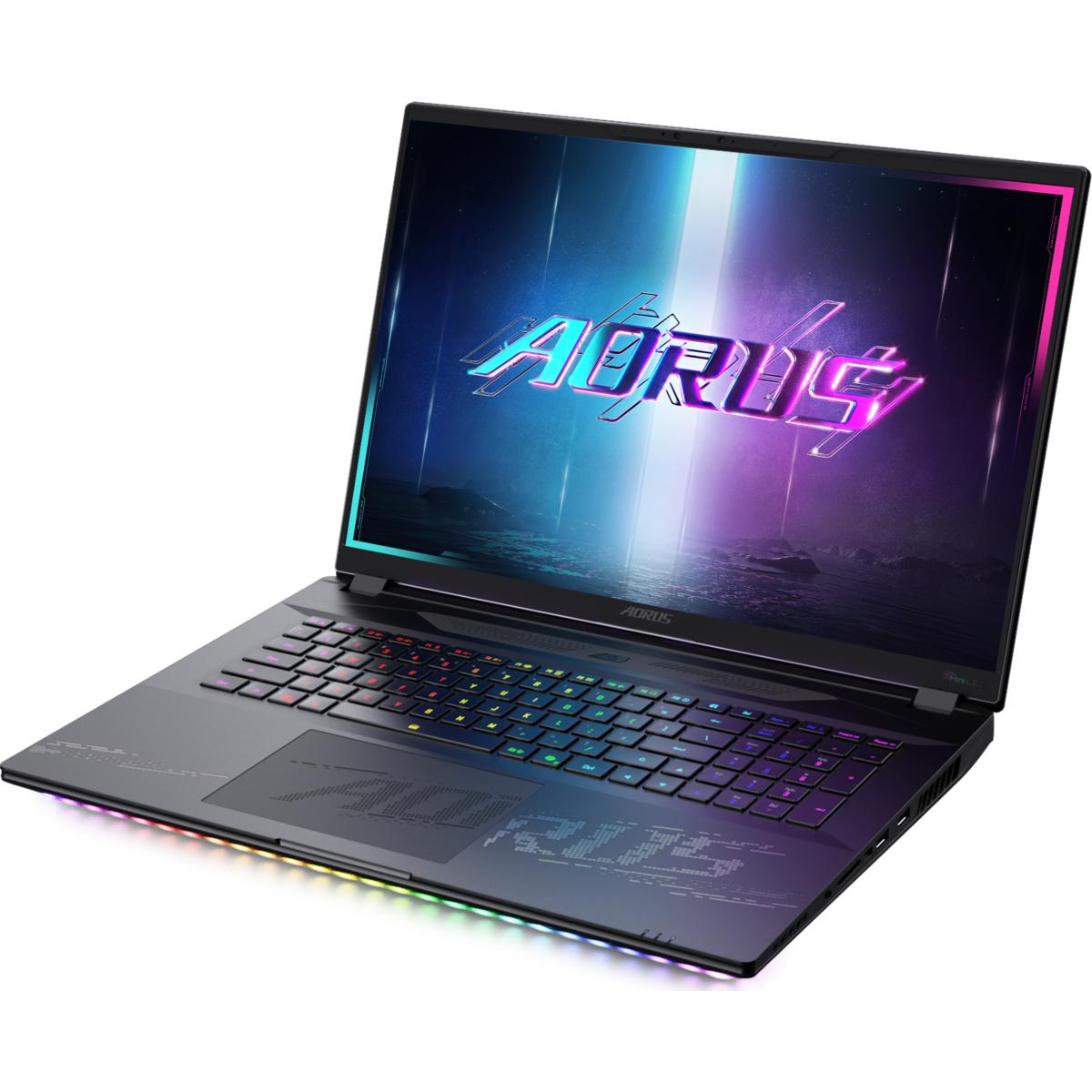 Ein schwarzer AORUS-Laptop ist geöffnet und zeigt das Markenlogo. Die Tastatur hat bunte Lichter. Der Bildschirm zeigt eine Landschaft mit dem Logo.