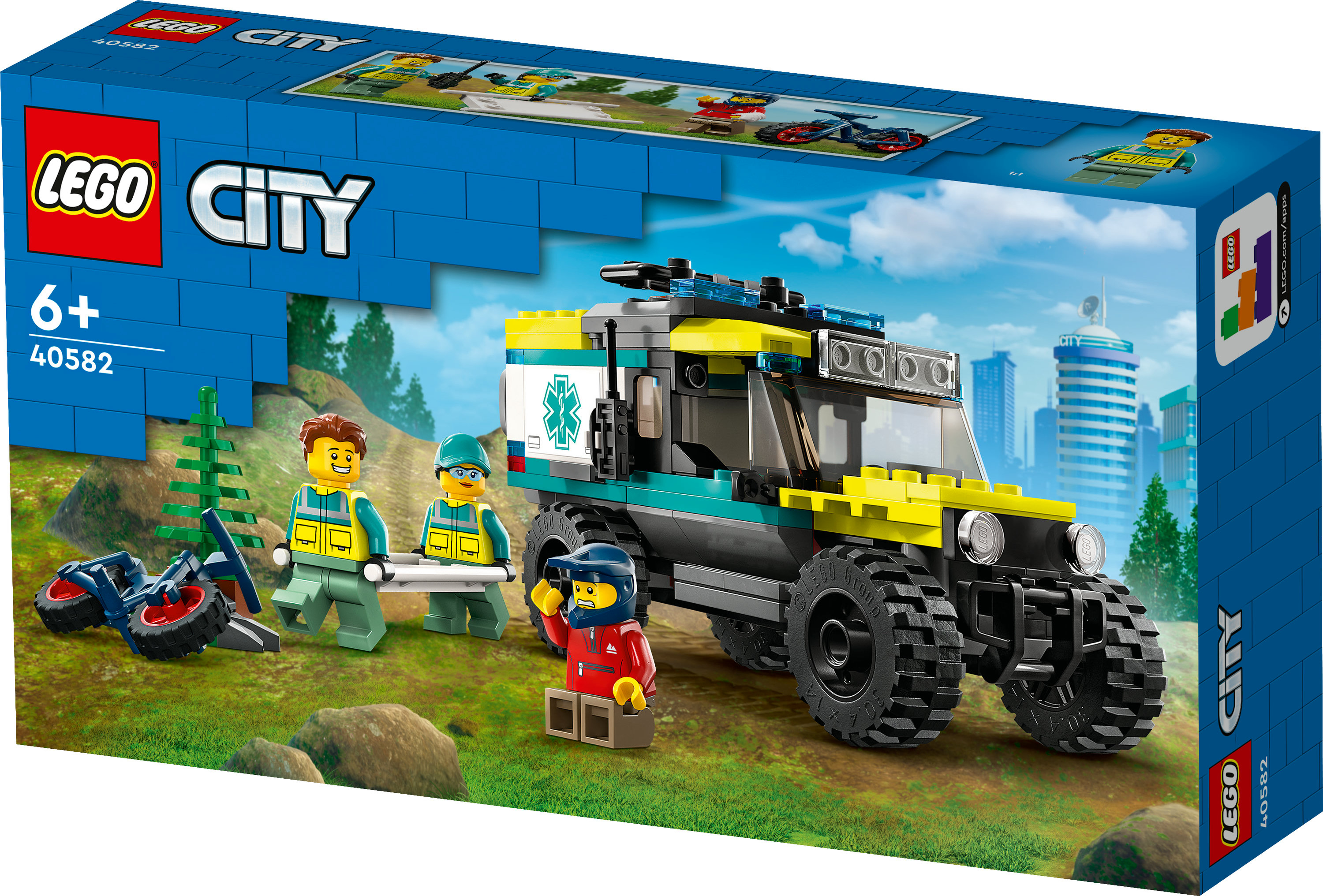 Çimenli bir arazide Lego City ambulans seti. Paramedikler ve bir motosikletçi dahildir.