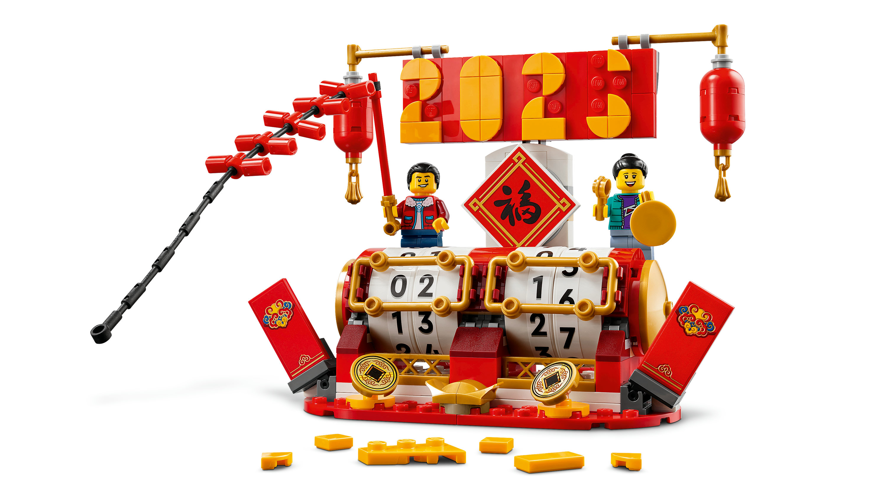 Set Lego con personaggi, lanterne e calendario. Colori rosso e oro. Personaggi davanti.