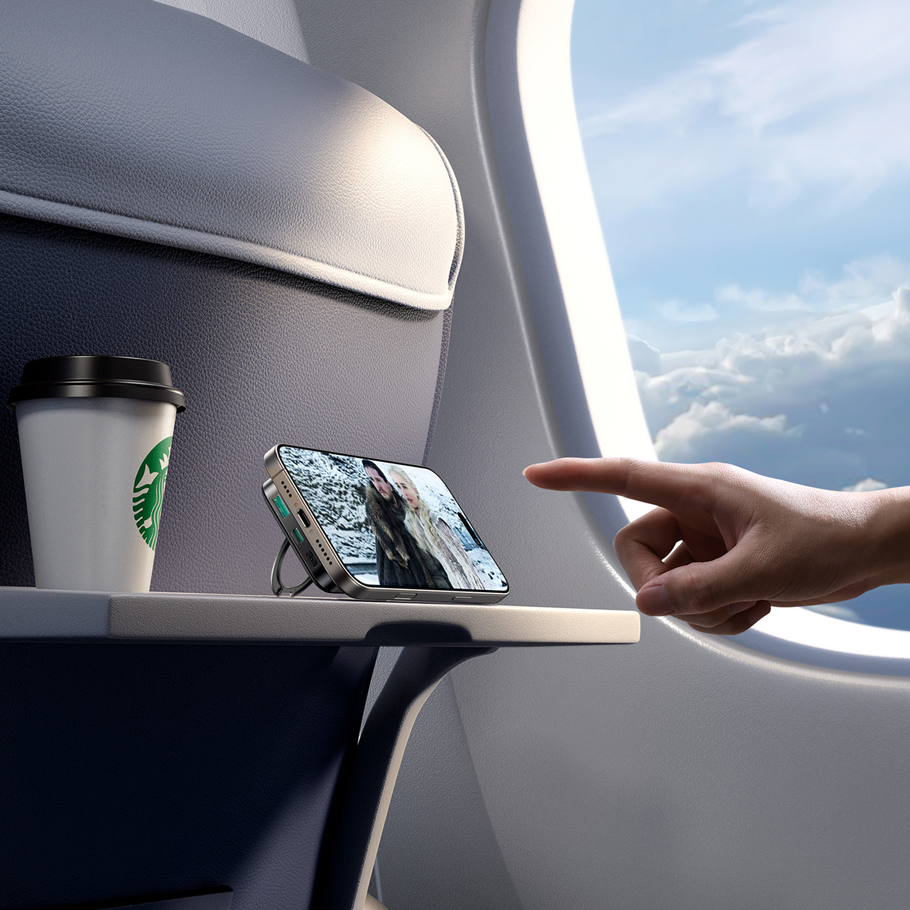 Telefon z power bankiem w samolocie. Telefon wyświetla wideo.