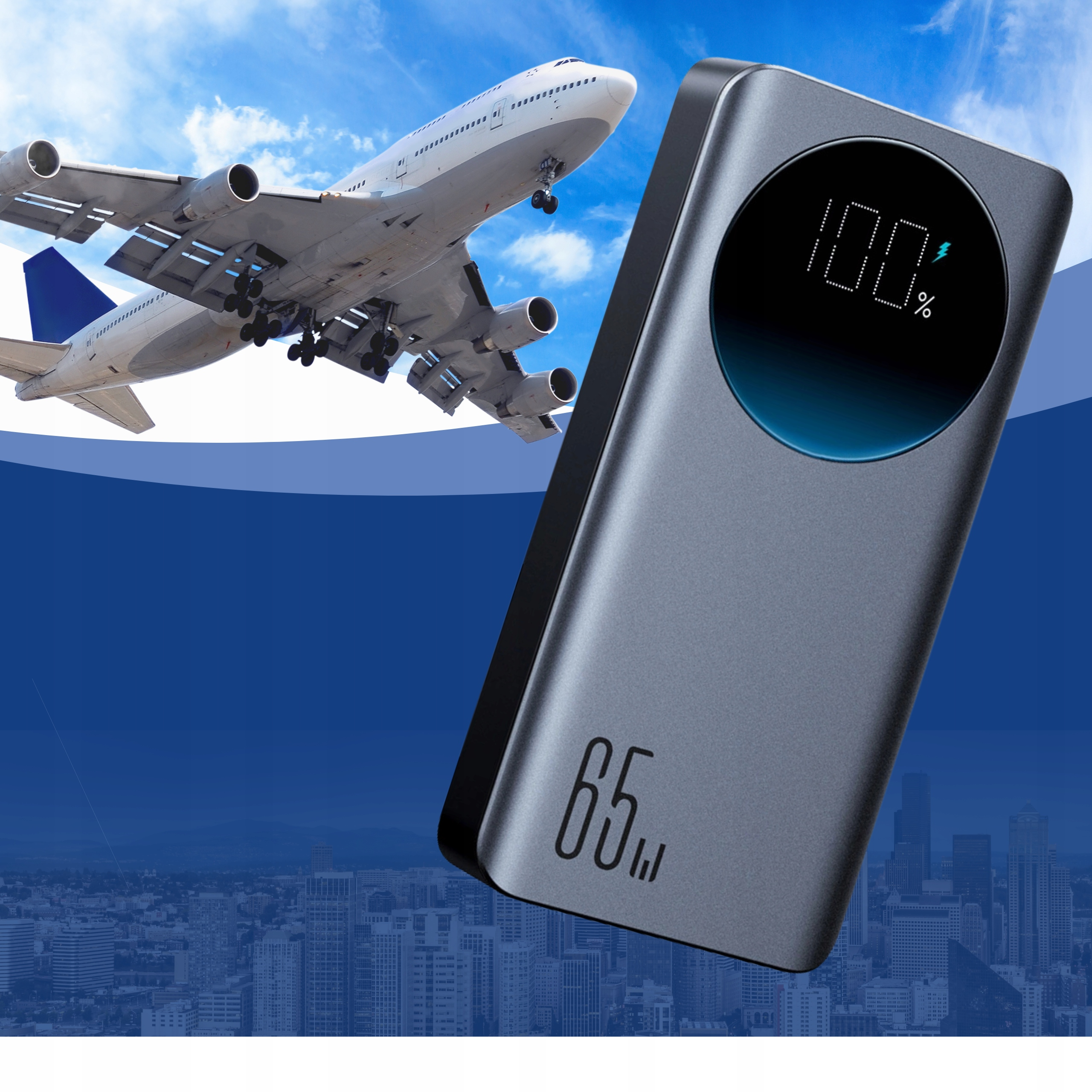 Power bank z samolotem w tle. Bank pokazuje 100% naładowania i 65W.