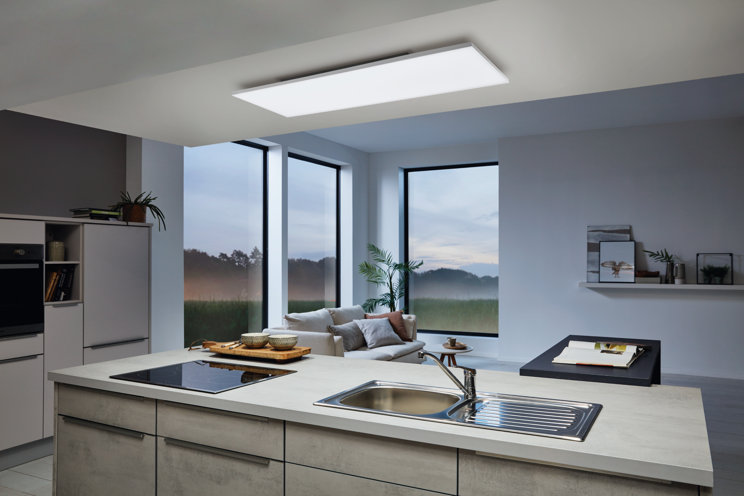 Una cocina moderna cuenta con un panel de luz LED blanco, mejorando el espacio vital brillante y abierto.