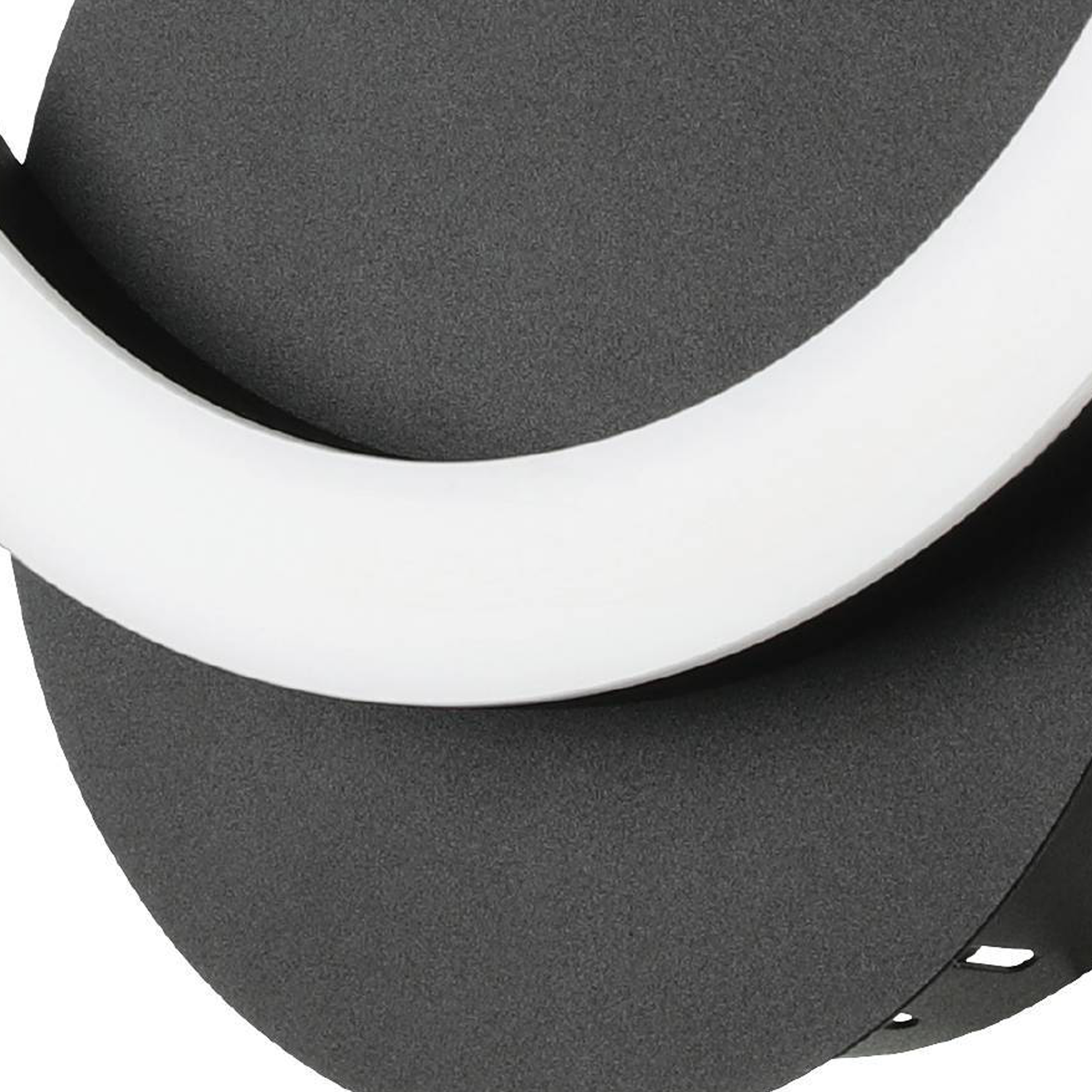 Primo piano di una lampada grigia con una luce circolare bianca su uno sfondo bianco.