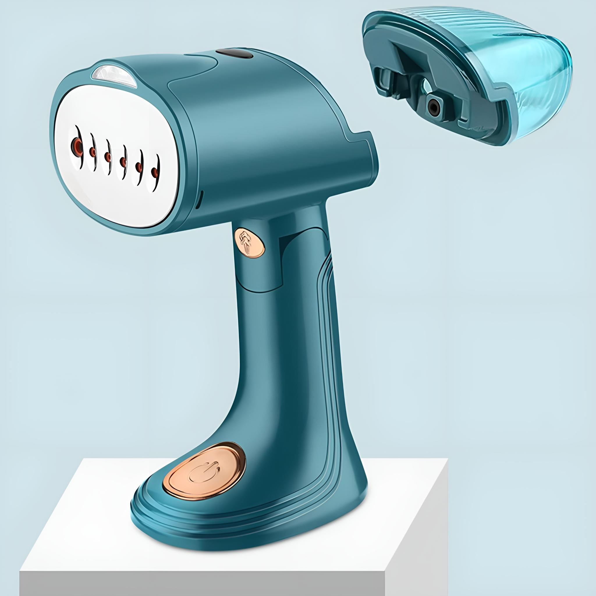 Ein teal-farbener Handdampfer mit abnehmbarem Wassertank, der auf einer weißen Oberfläche steht.