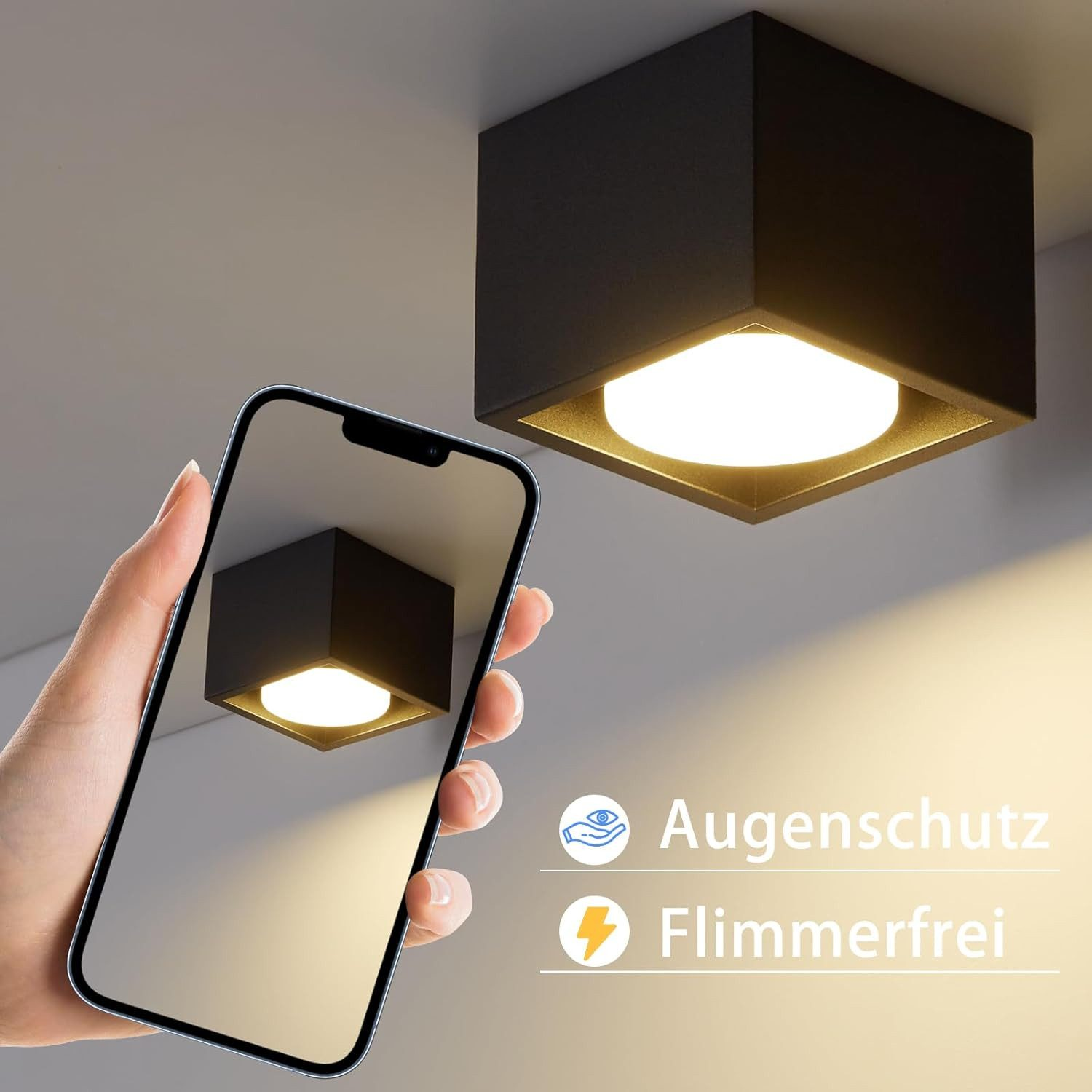 Una mano che tiene un telefono che mostra una plafoniera. Un'altra luce è sul soffitto. Testo: Augenschutz, Flimmerfrei.