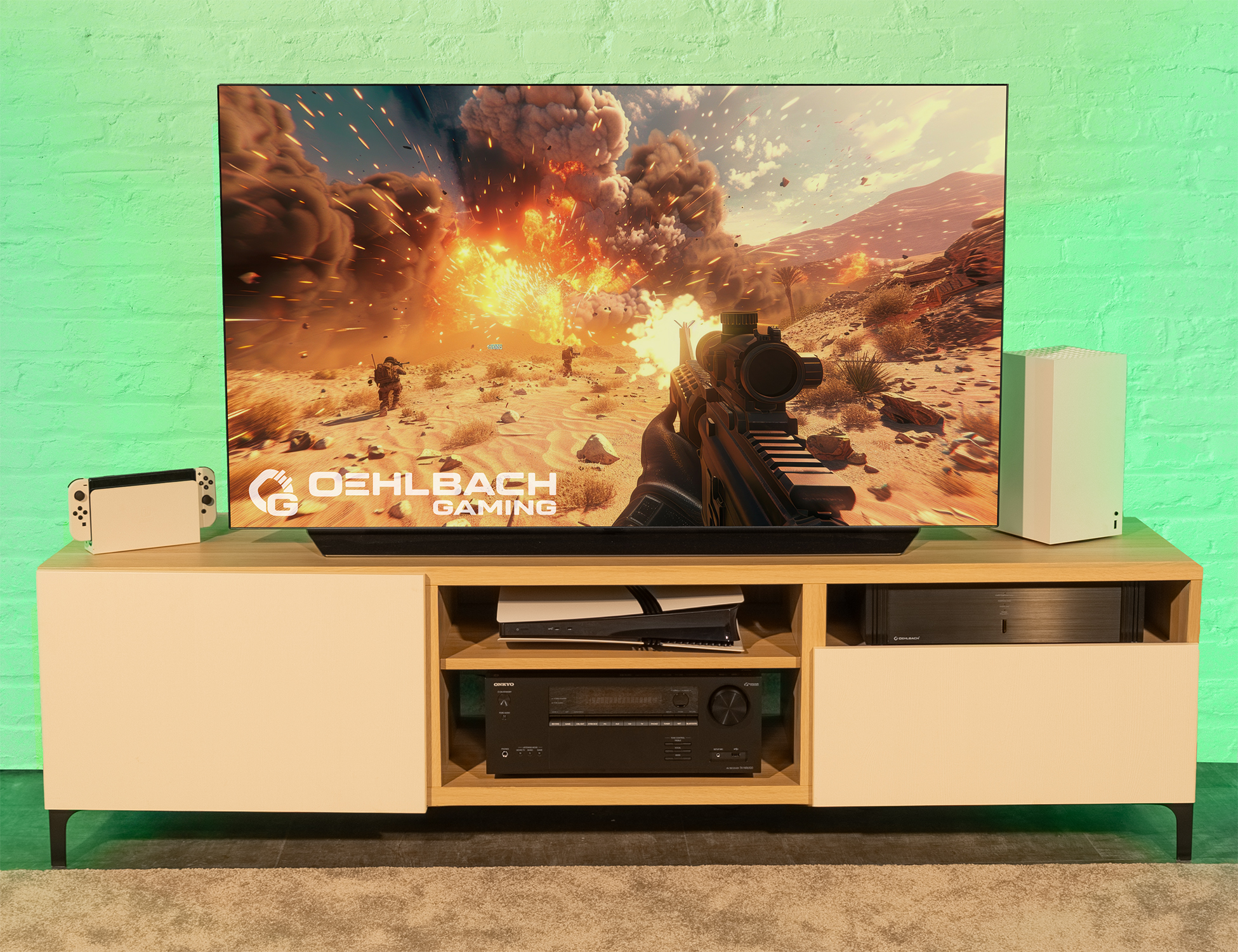 Ein Fernseher zeigt eine Videospielszene einer Wüstenlandschaft, darunter Spielkonsolen und -geräte.