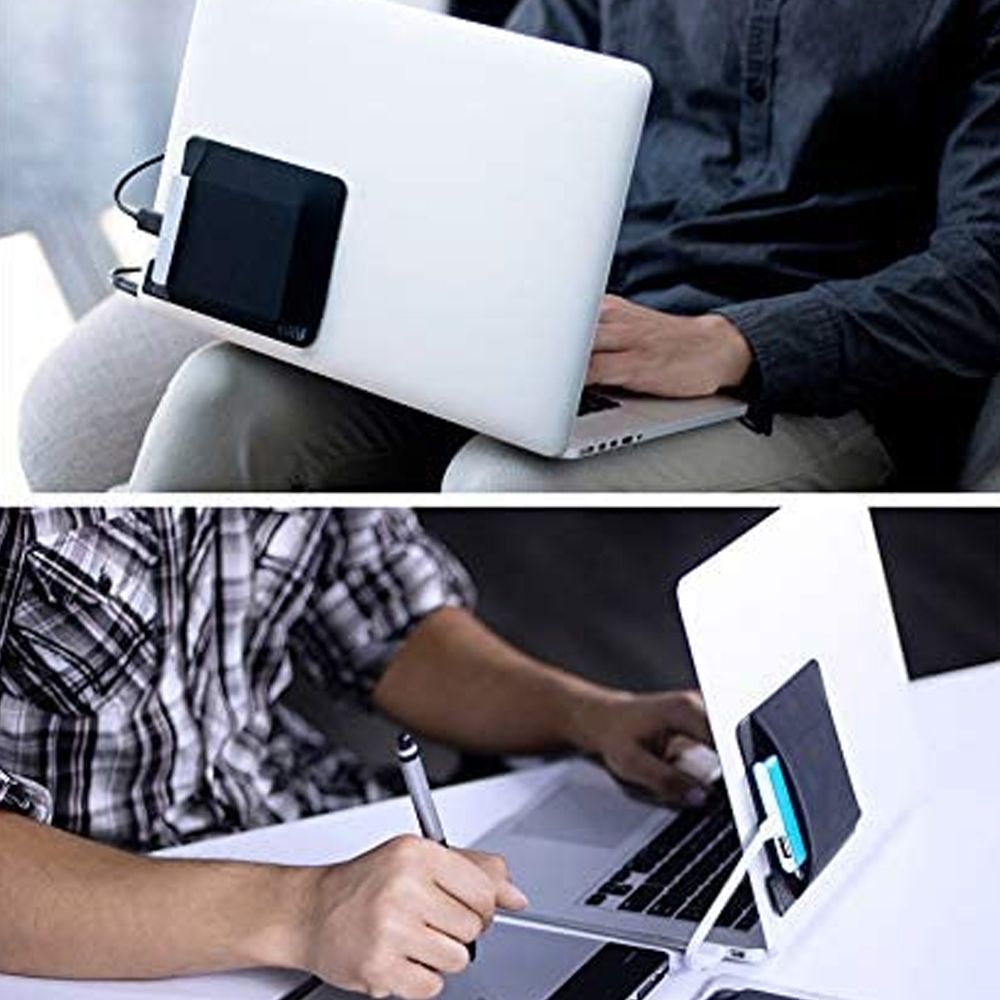 Eine schwarze Tasche ist an einem weißen Laptop befestigt. Eine Person benutzt den Laptop. Die Tasche enthält Gegenstände.
