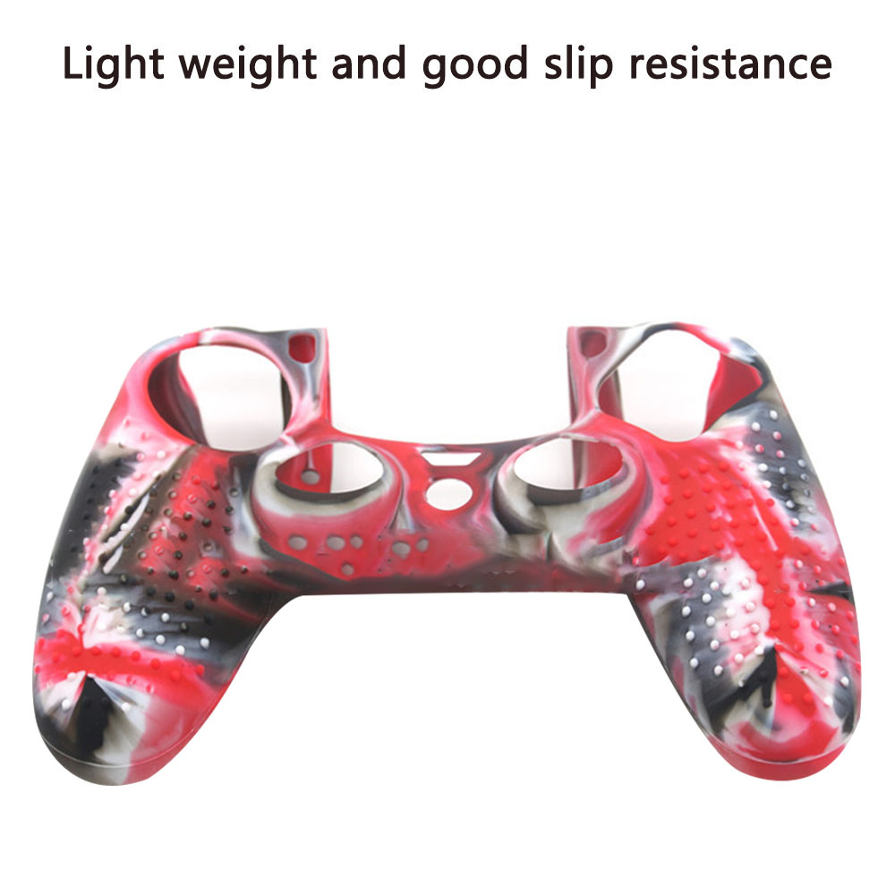 Das Bild zeigt eine rote, weiße und schwarze Silikonhülle für einen Playstation-Controller.