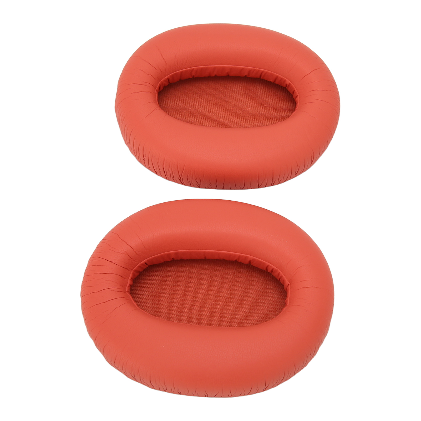Zwei orangefarbene Kopfhörer-Ohrpolster. Sie sind rund und haben eine glatte, orange Oberfläche.