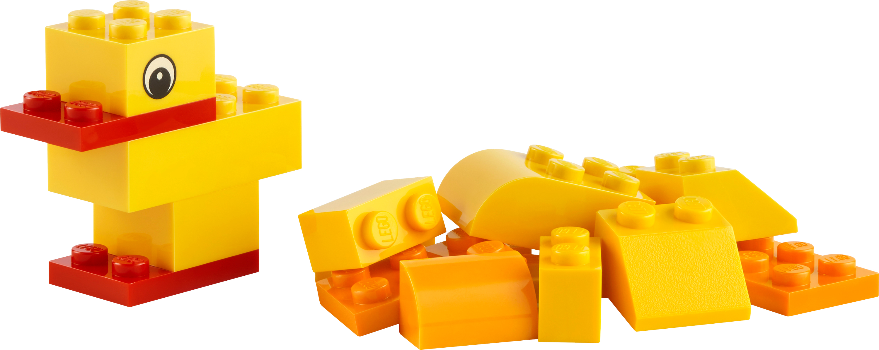 Kırmızı gagalı ve tabanlı sarı bir ördek oluşturmak üzere düzenlenmiş Lego tuğlaları ve dağınık sarı ve turuncu tuğlalar.
