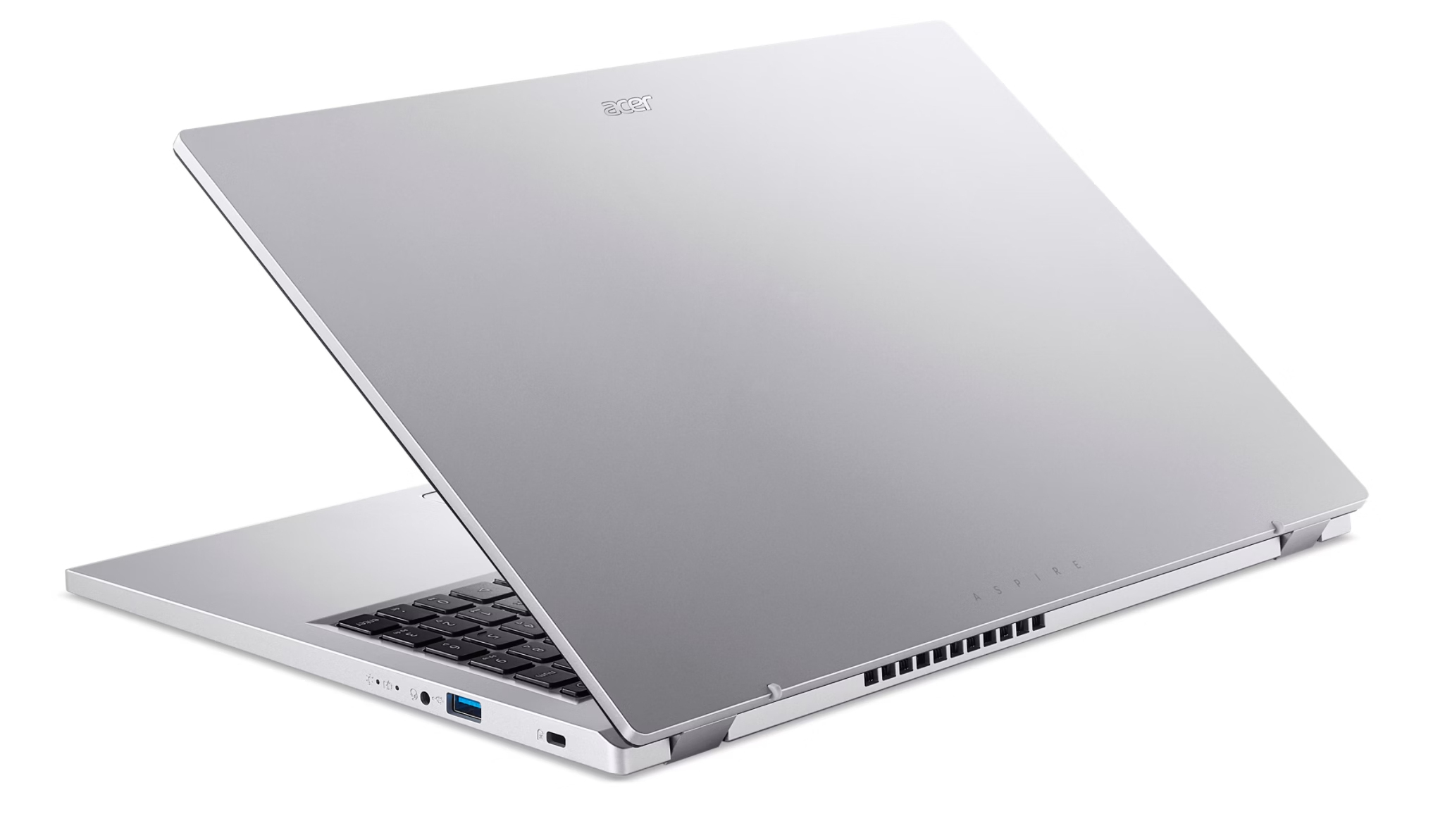 Un laptop argentato è mostrato ad angolo, rivelando il suo pannello posteriore e uno sguardo alla tastiera.