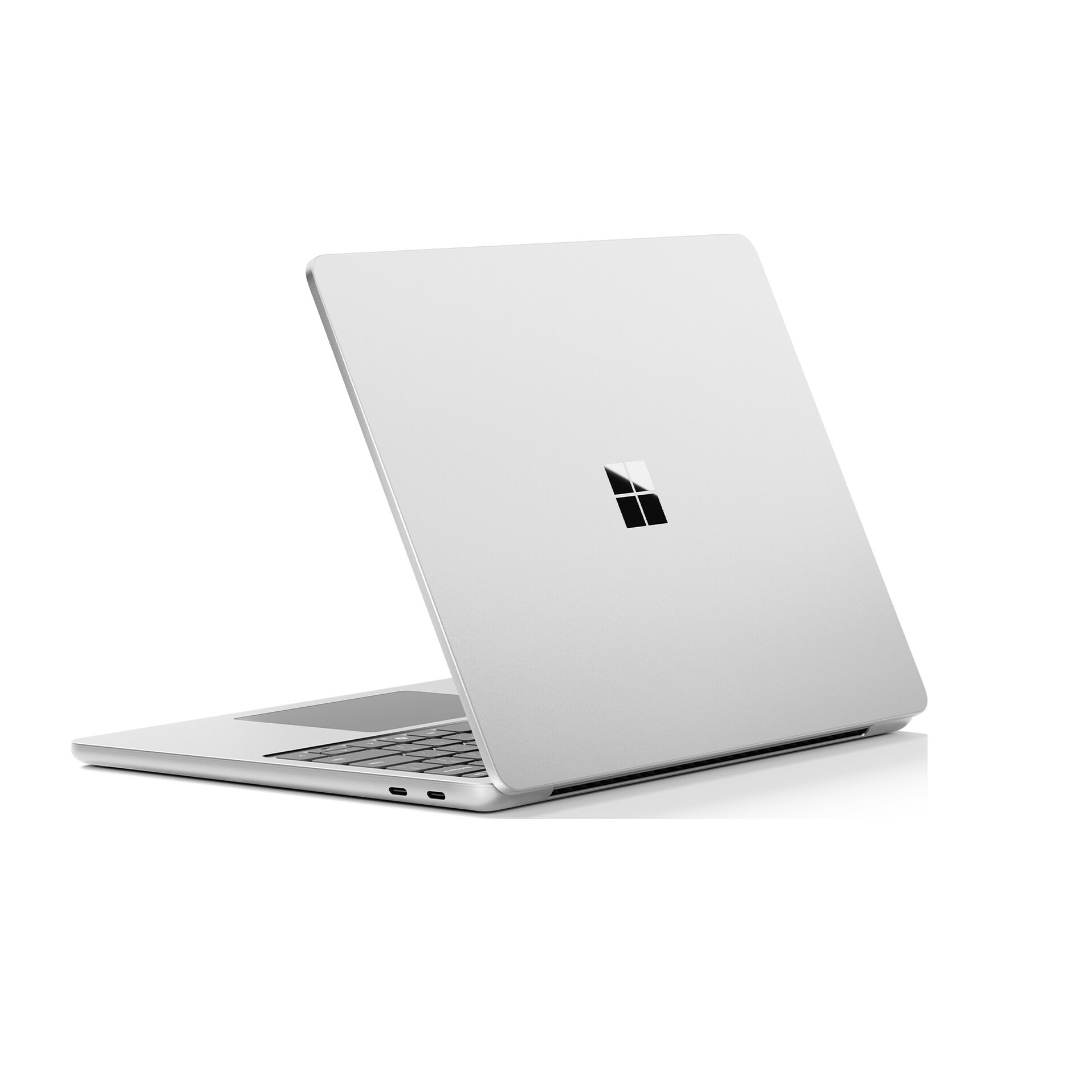 Laptop con cornice argentata, chiuso su un tavolo. Il retro ha un logo di un quadrato nero.