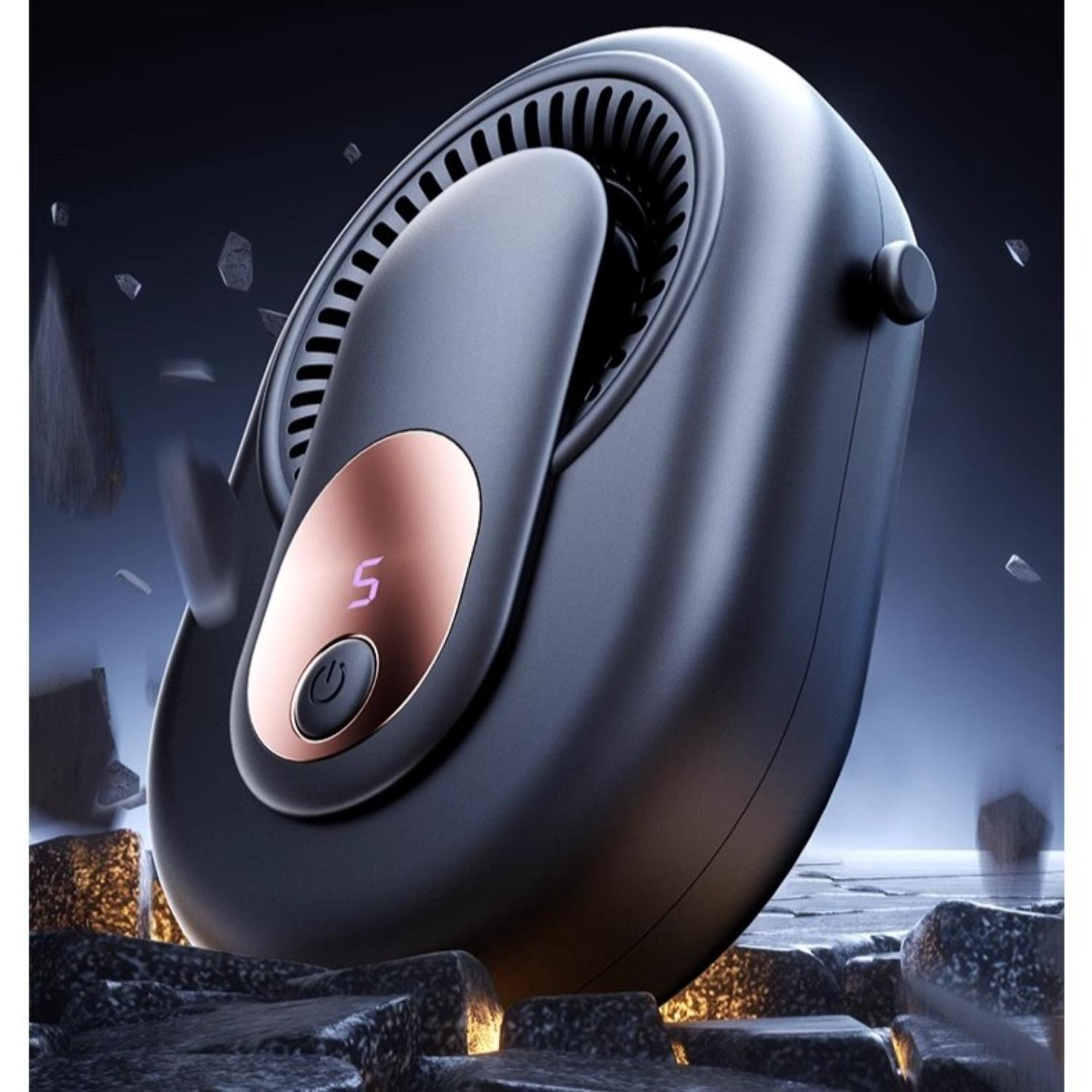 Ein schwarzer tragbarer Ventilator mit Digitalanzeige ruht auf Felsen.