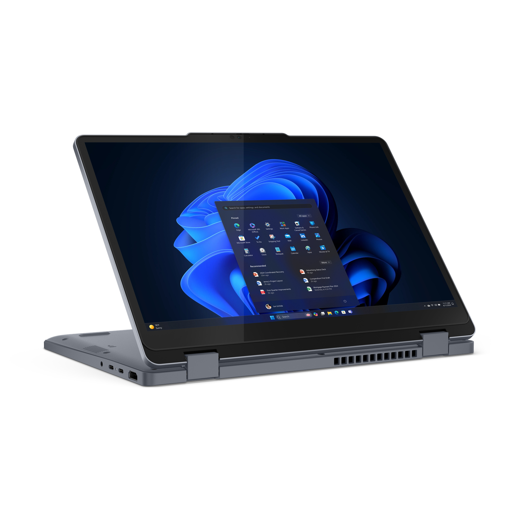 Laptop grigio in modalità tenda che mostra Windows, con porte visibili sul lato.