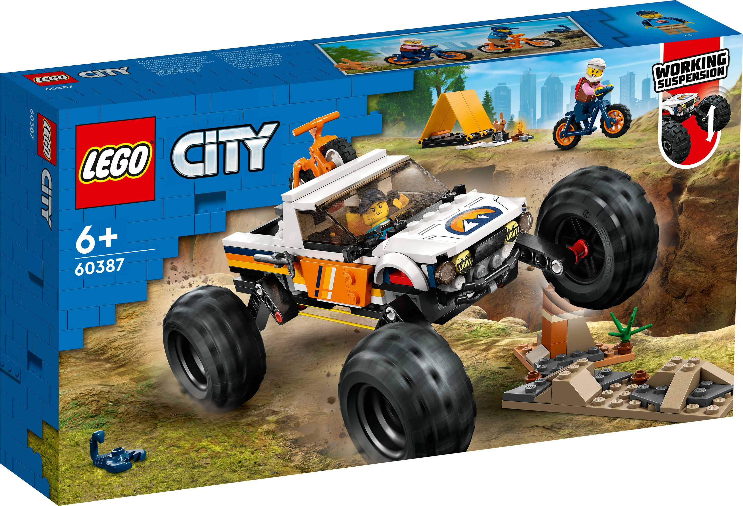 Caja del set Lego City: Camión monstruo, conductor y una pequeña escena con tienda y moto.