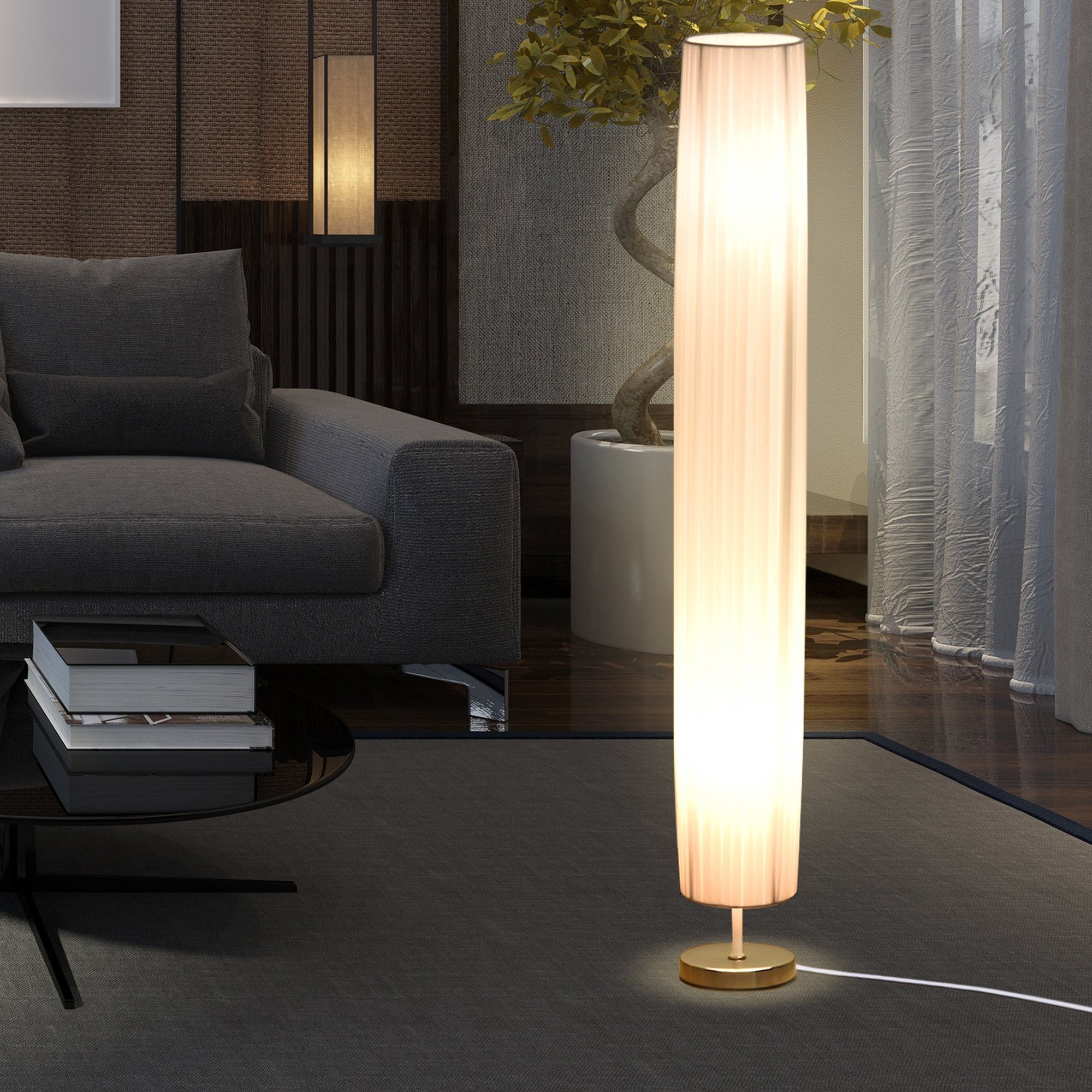 Una lámpara de pie alta iluminada con pantalla plisada, situada en un salón.