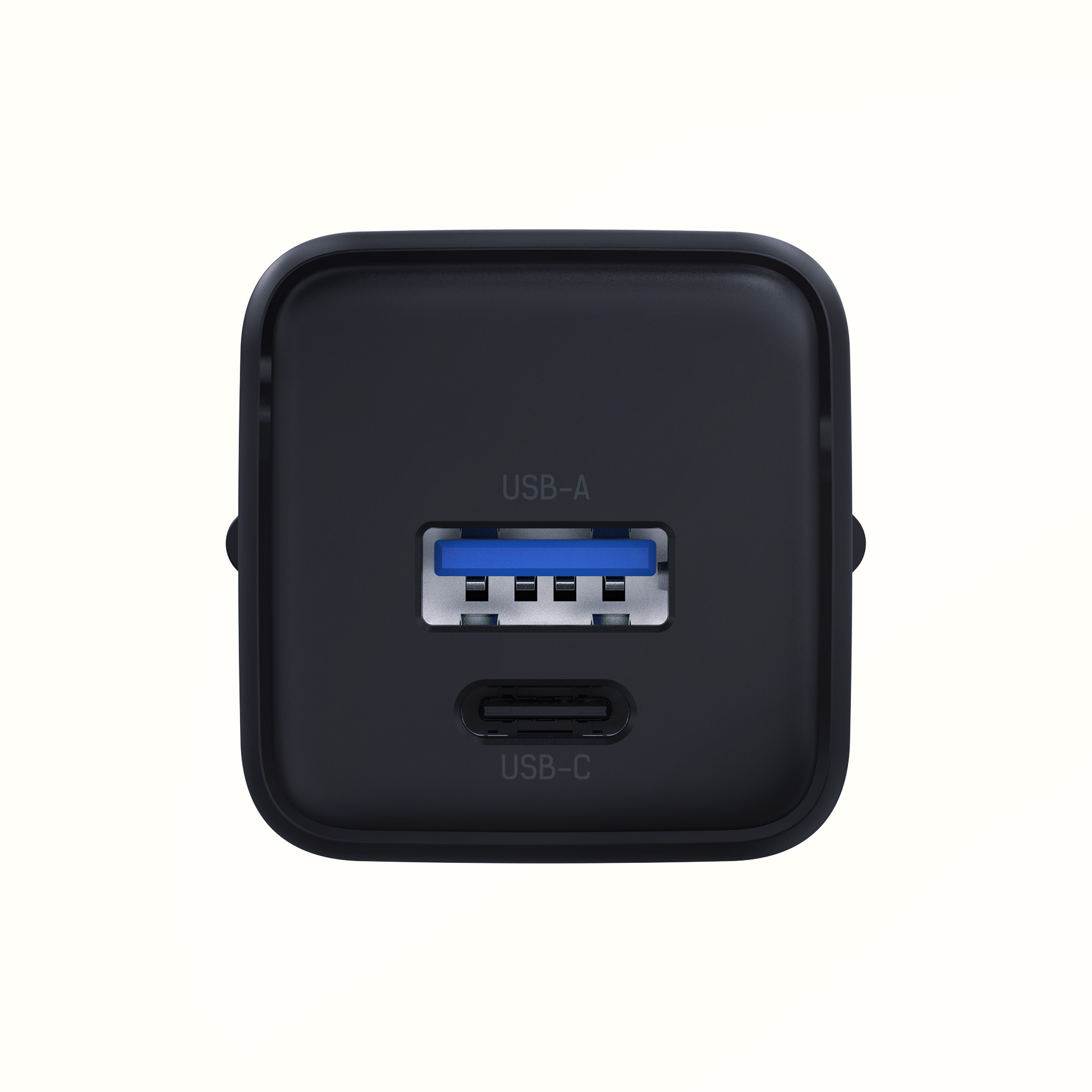 Zbliżenie czarnej ładowarki z portami USB-A i USB-C.