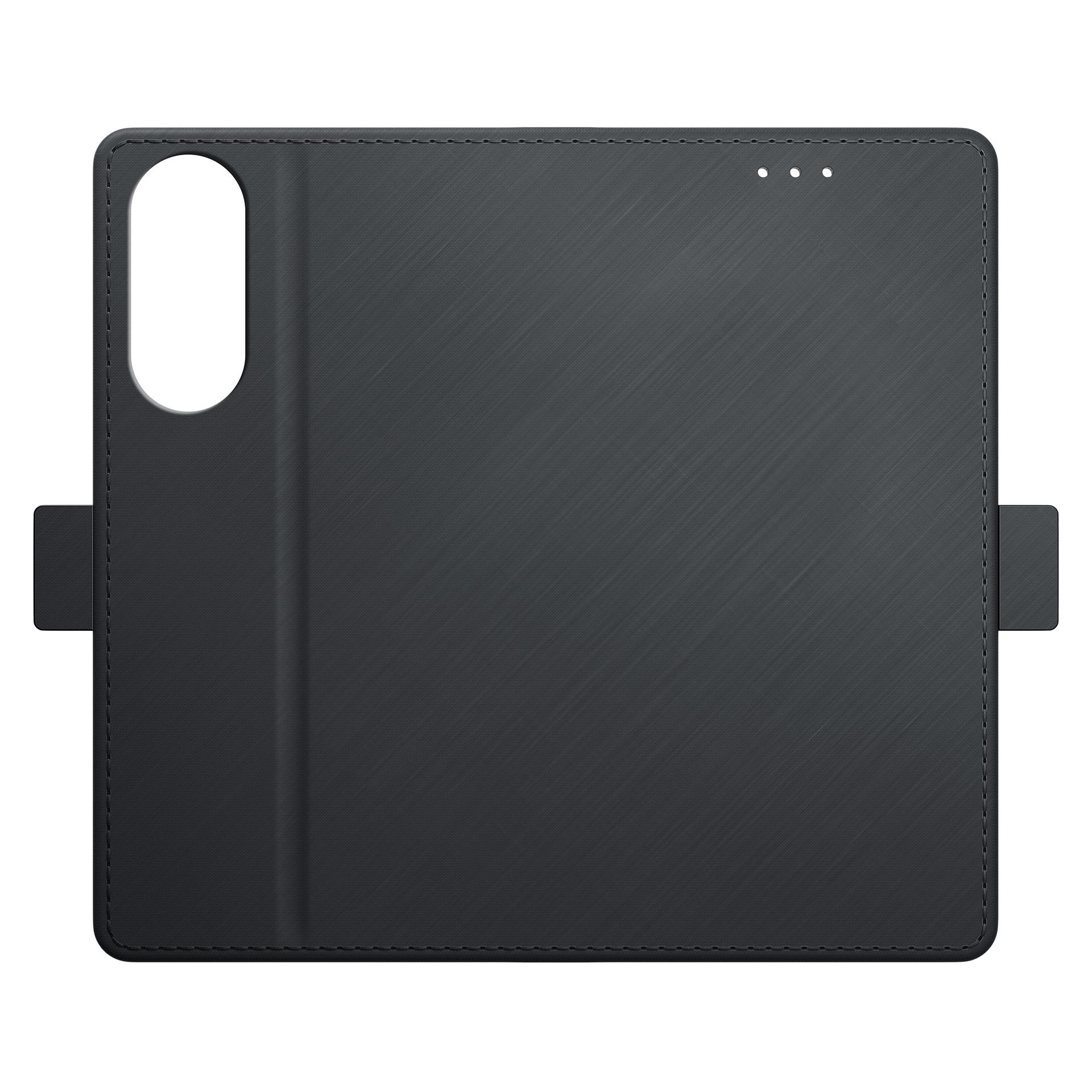 Zdjęcie zamkniętego czarnego etui portfelowego na telefon, prostego i zwykłego, na białym tle.