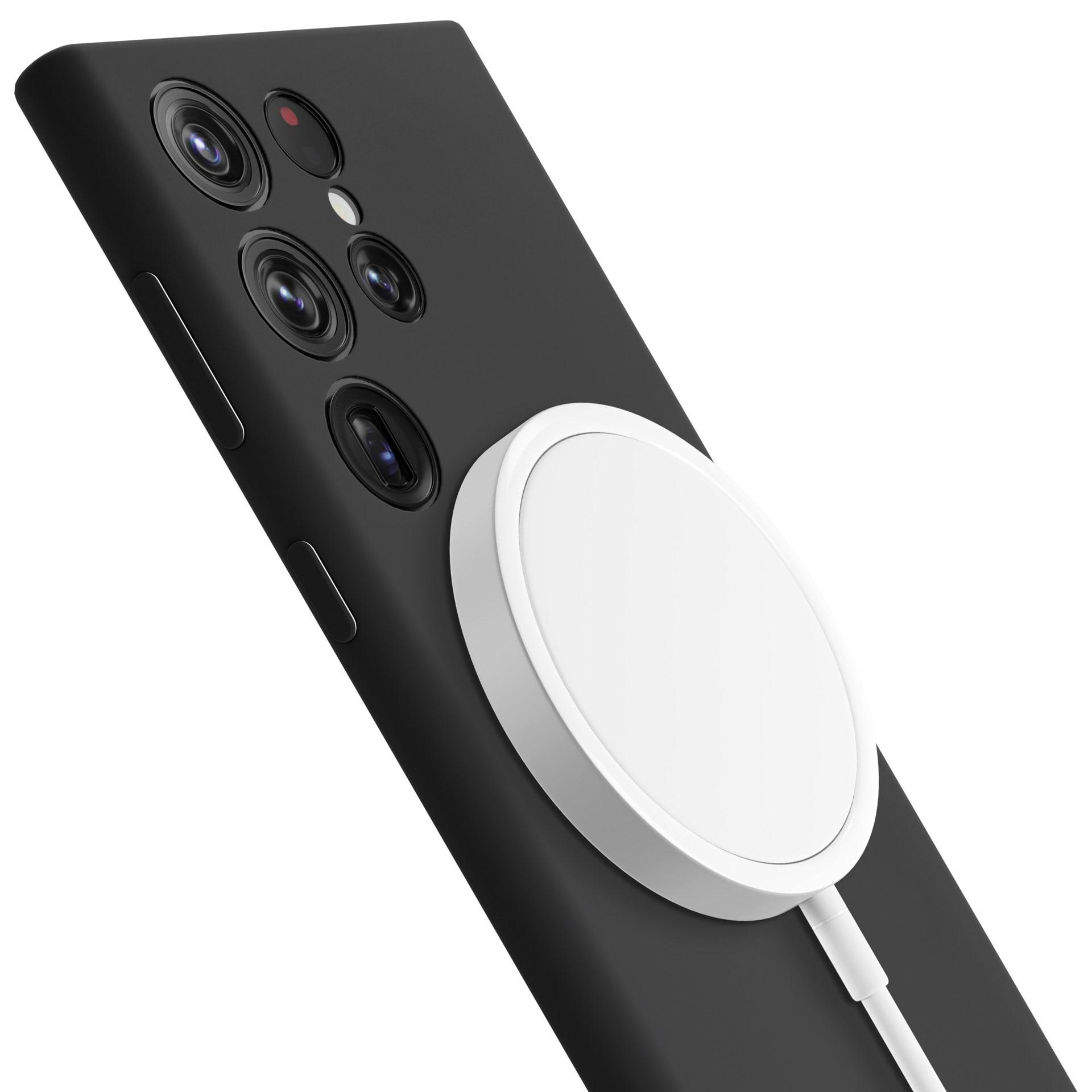 Czarny telefon z białą podkładką ładującą. Telefon ma wiele obiektywów aparatu. Białe tło.