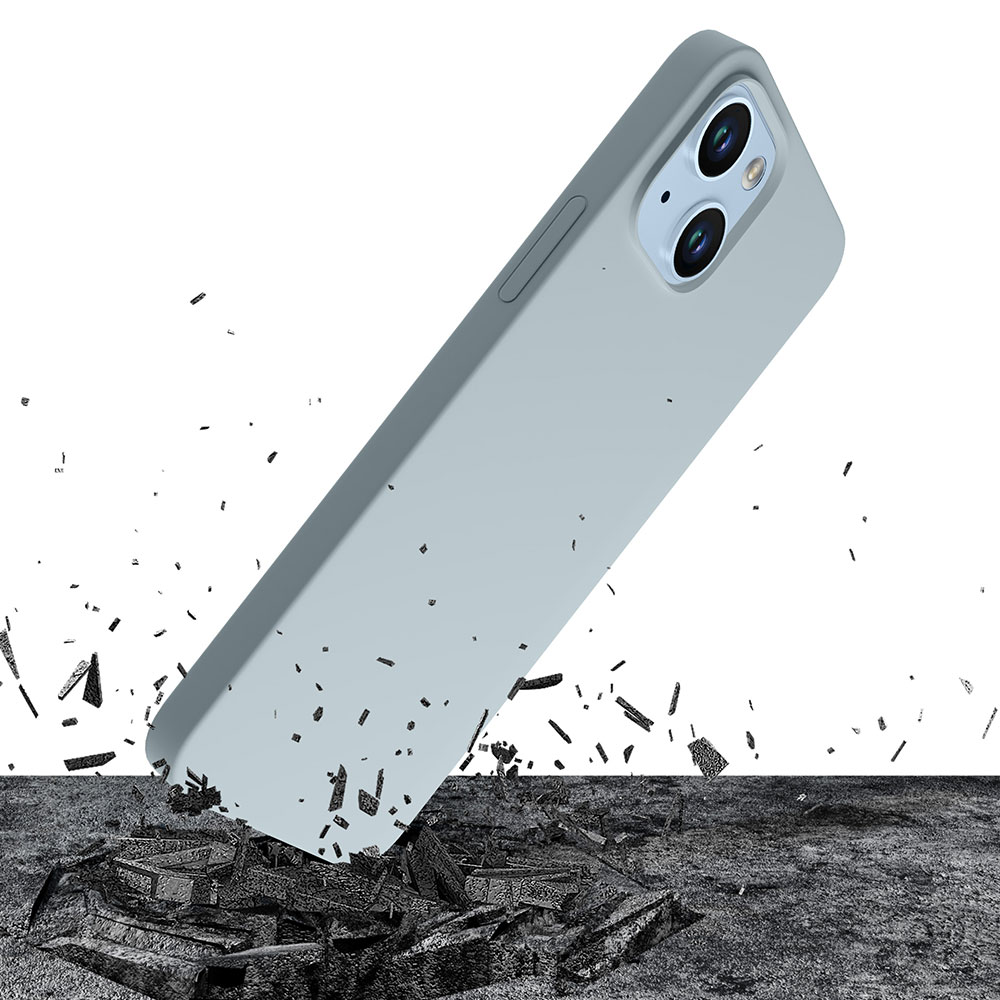 Jasnoniebieskie etui na telefon spadające na szarą powierzchnię z gruzem.
