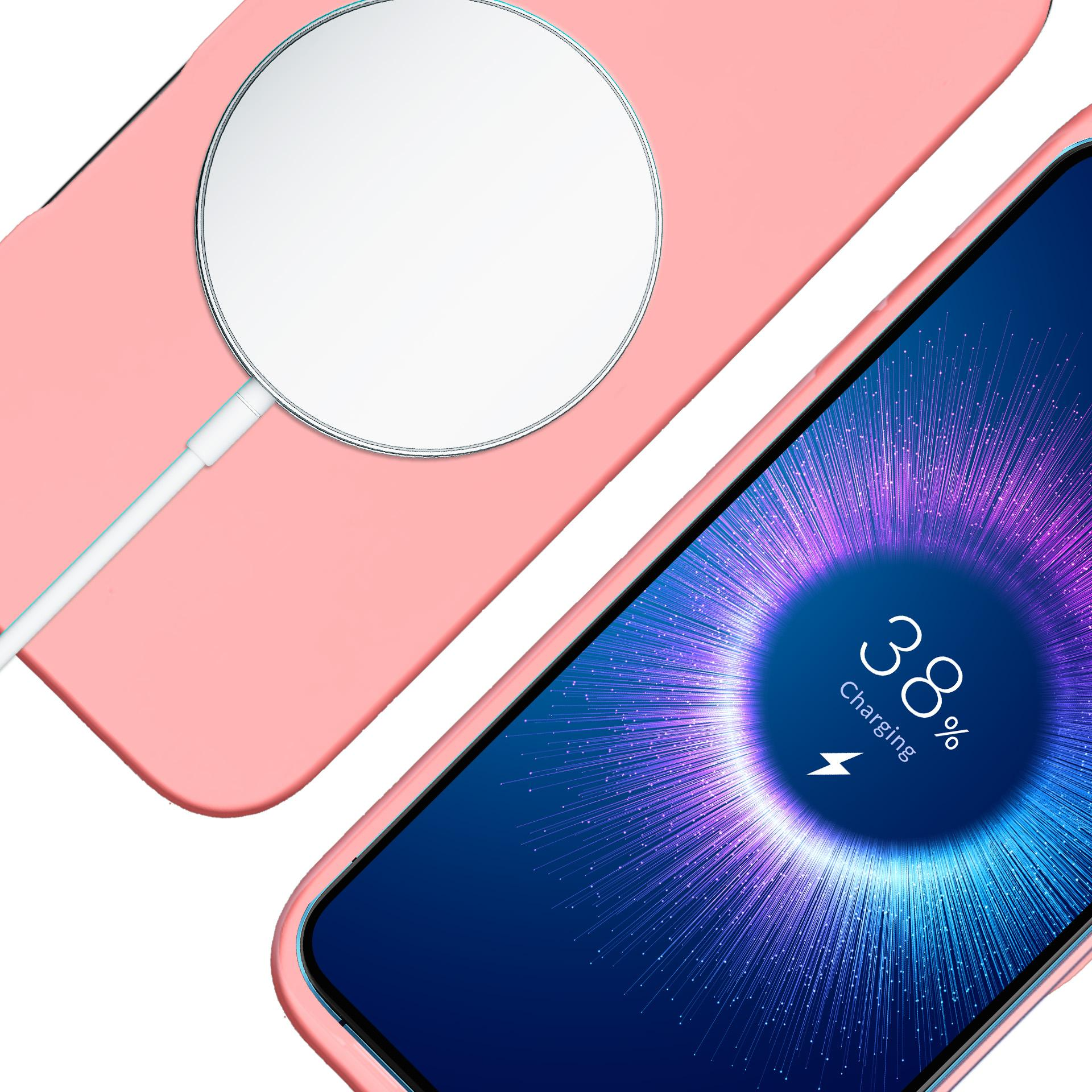 Telefon ładujący się na poziomie 38% z różowym etui i ładowarką bezprzewodową.