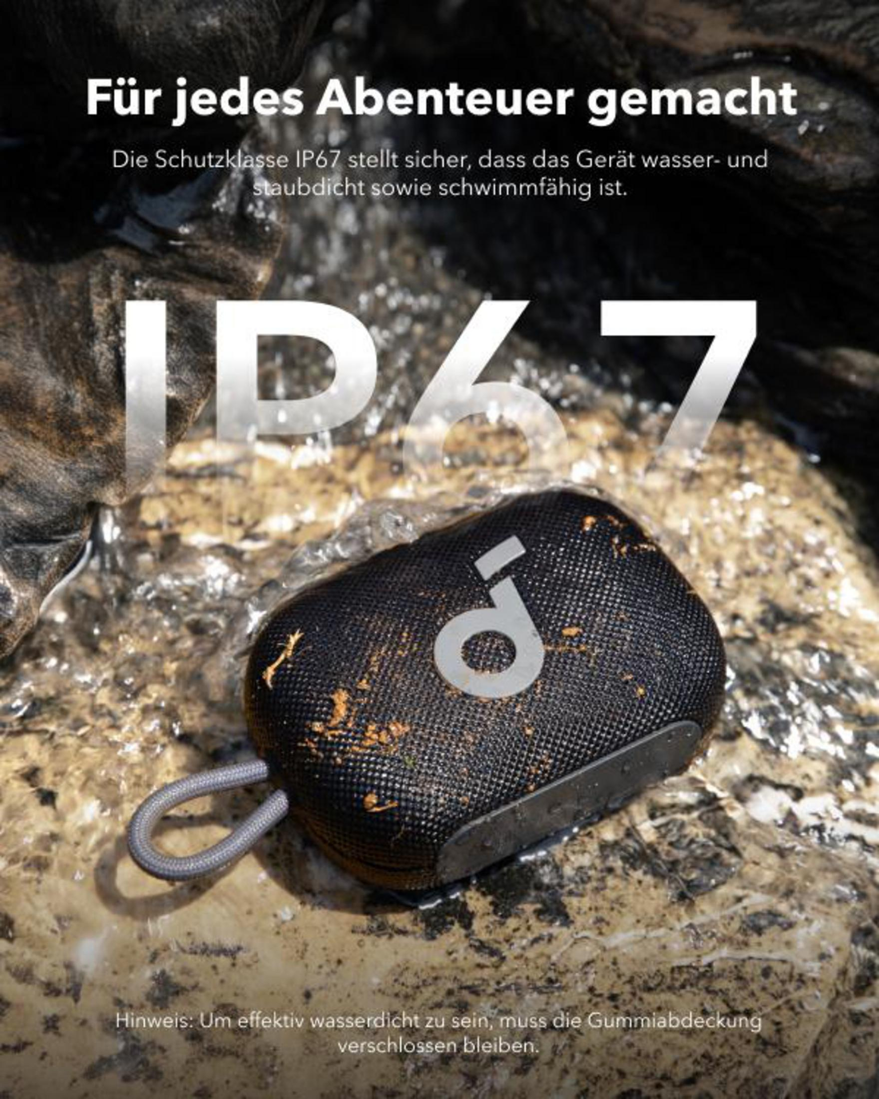 Czarny głośnik Anker Soundcore Select 2 z szarą pętlą jest częściowo zanurzony w wodzie.