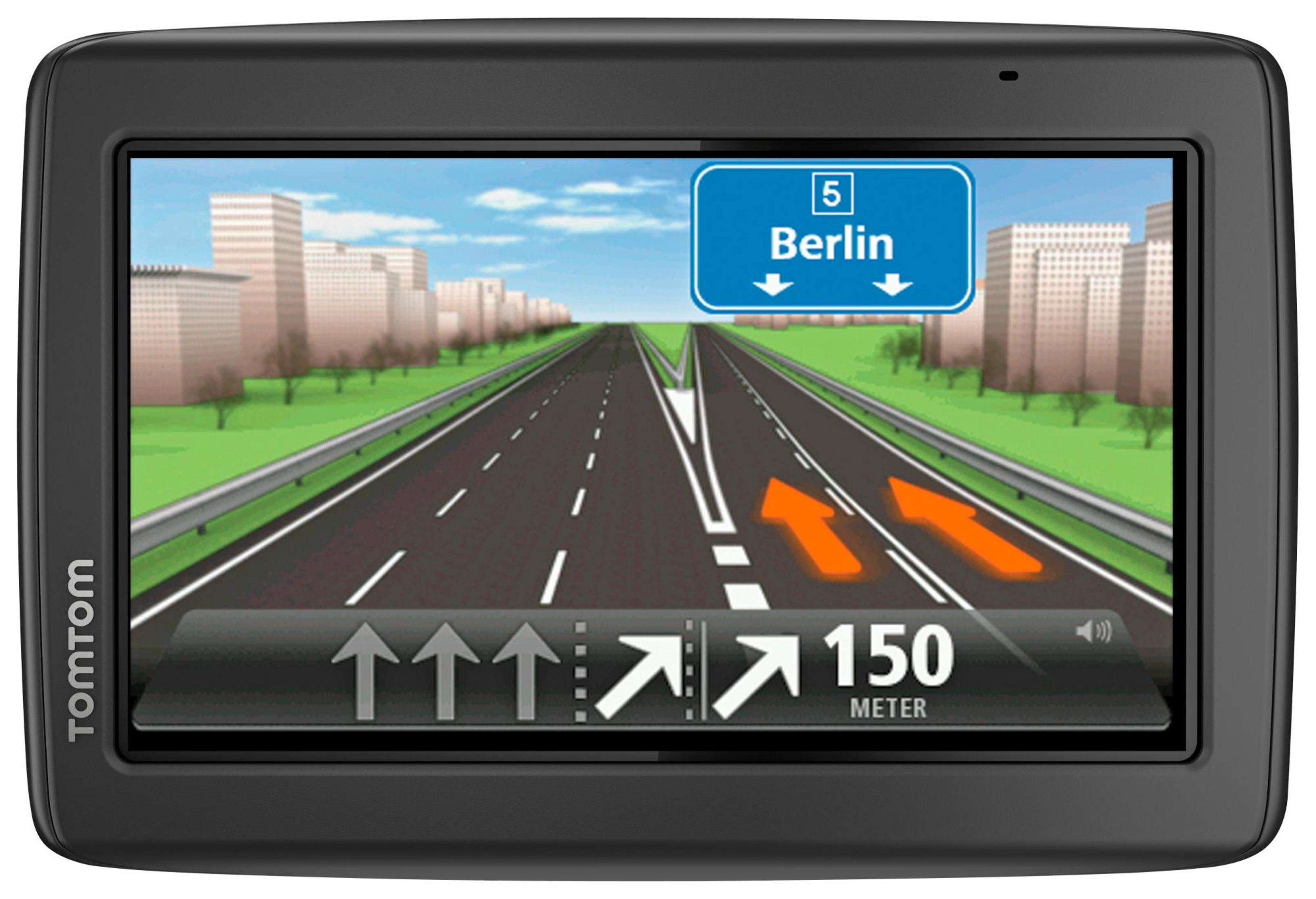 Das TomTom GPS-Gerät zeigt eine Autobahn in Richtung Berlin, mit Gebäuden und einem blauen Himmel im Hintergrund.