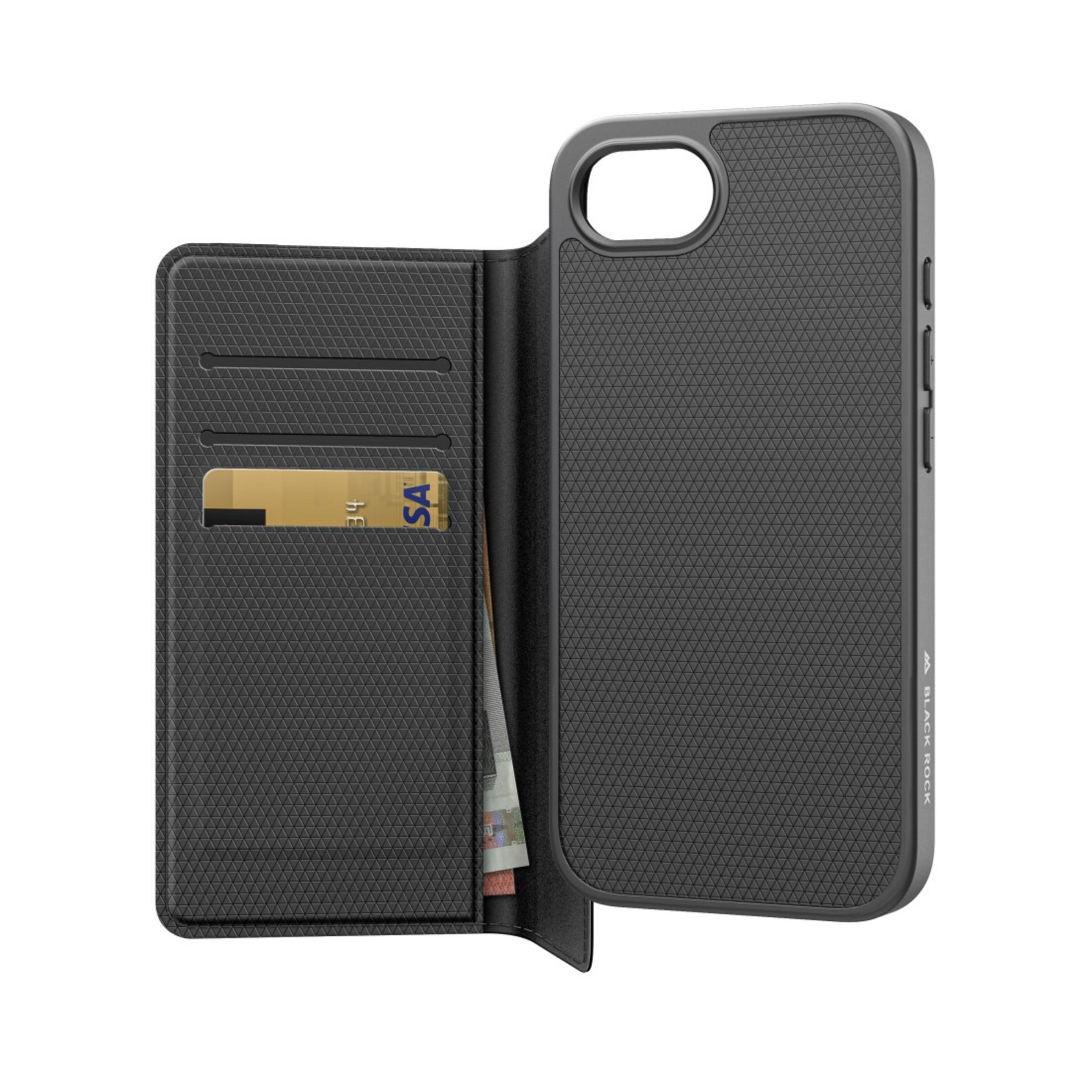 Étui de téléphone ouvert avec des fentes pour cartes, affichant une carte de crédit et de l'argent liquide. Le téléphone est à droite.