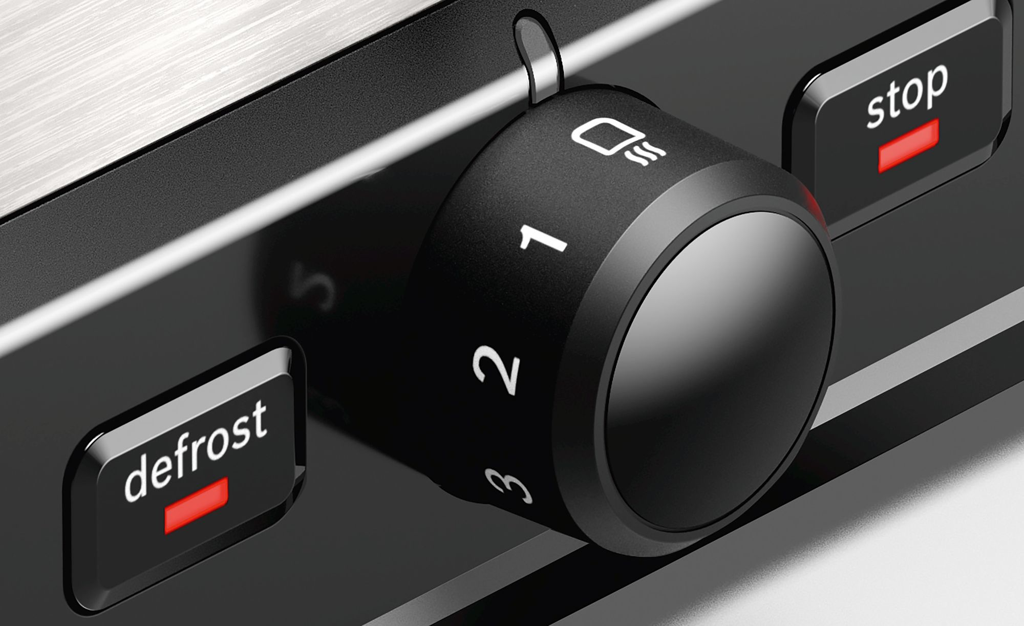 Close up of the toaster dial. It has numbers, a toaster symbol and 'defrost' and 'stop' buttons.
