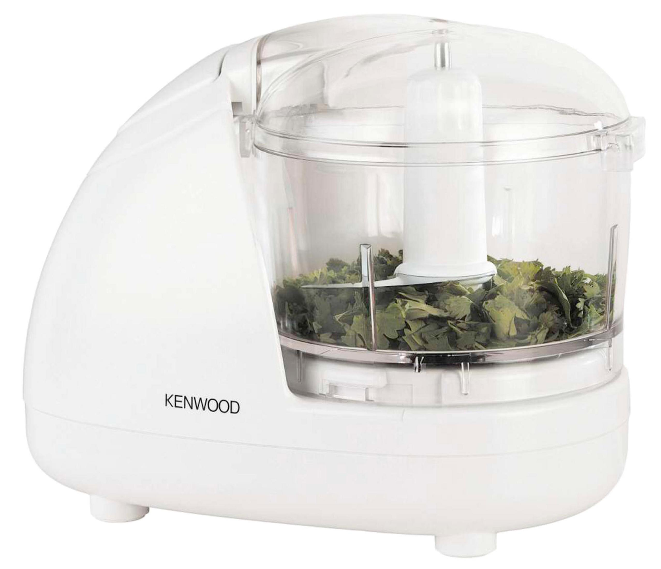 Ein weißer Kenwood-Zerkleinerer mit gehackten grünen Kräutern in einer transparenten Plastikschüssel wird gezeigt.