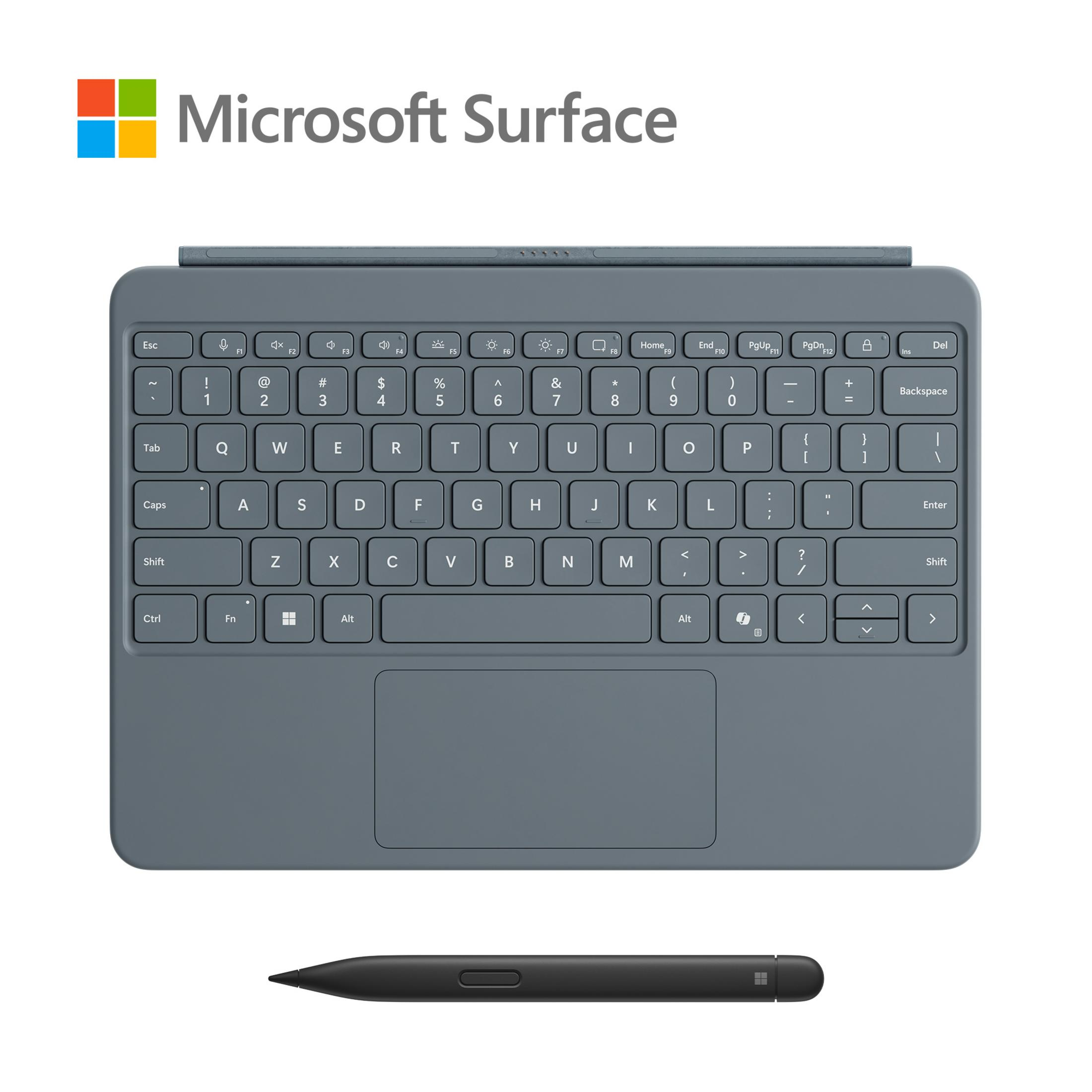Una tastiera grigia con un touchpad e una penna. Il logo Microsoft Surface si trova nell'angolo in alto a sinistra.