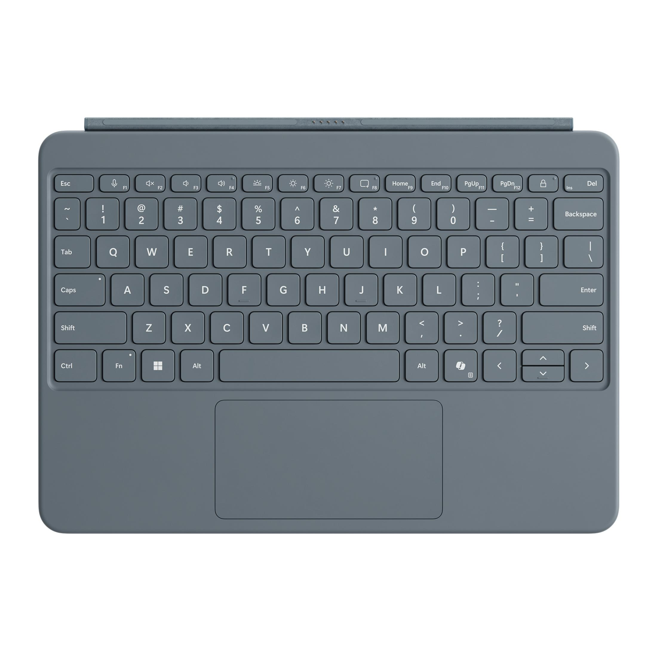 Una tastiera grigia con un touchpad. Ci sono vari tasti sulla tastiera. Lo sfondo è bianco.