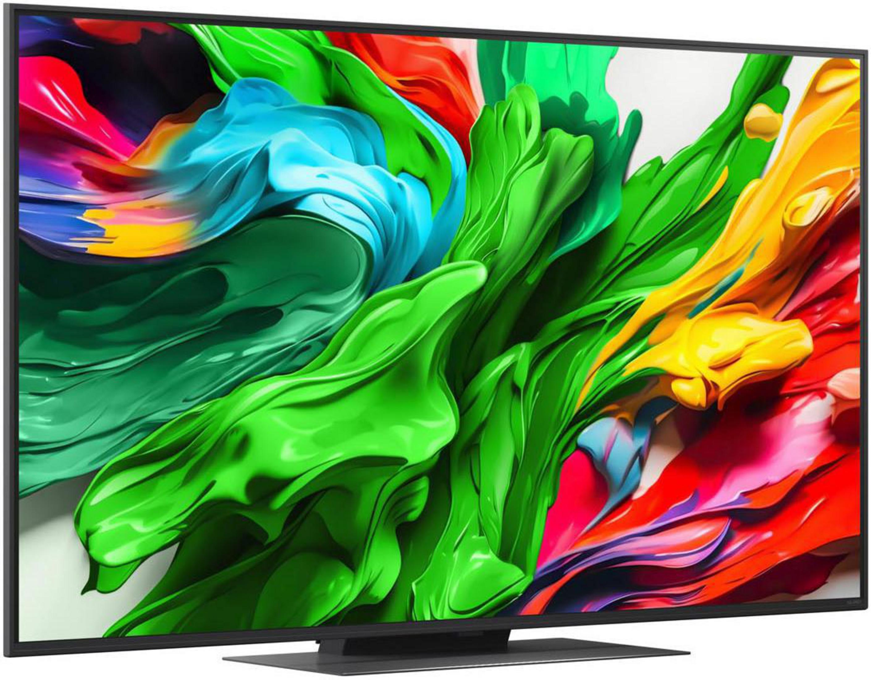 Ein Fernseher zeigt ein farbenfrohes abstraktes Design mit grünen, blauen, gelben und roten Farbtönen auf einem weißen Hintergrund.