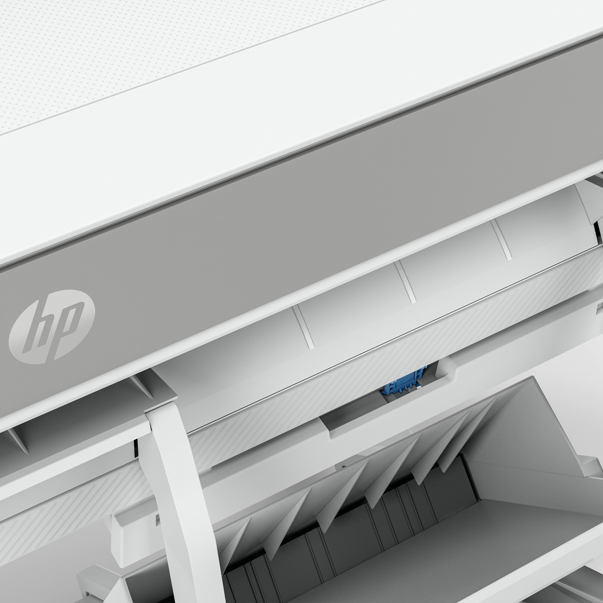 A close-up of the inside of a white printer, showing the paper loading mechanism.