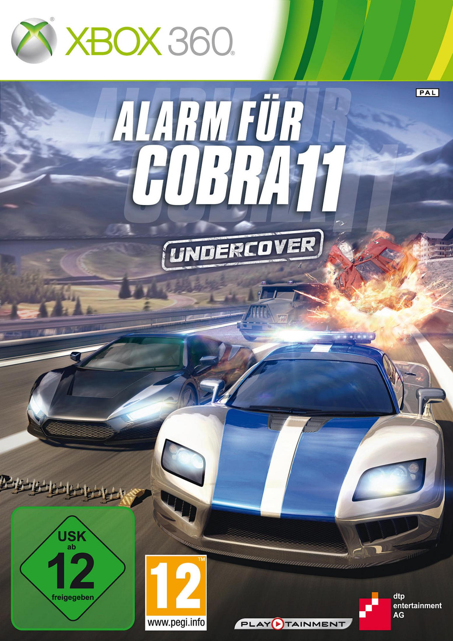 Das Cover des Videospiels zeigt zwei Autos, die vor einer Bergkulisse rasen, mit einer Hubschrauberexplosion.