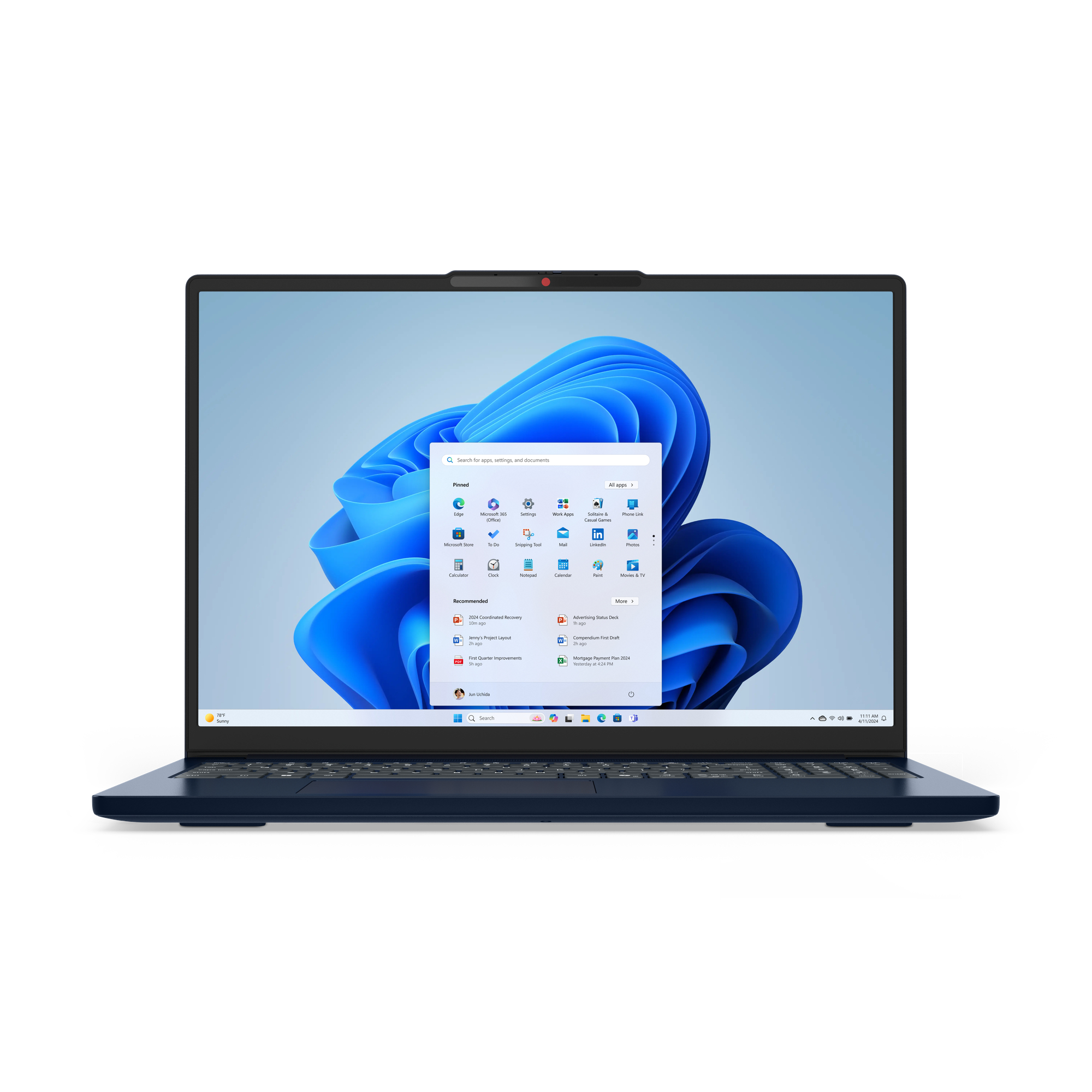 Windows 11 masaüstüne sahip açık mavi dizüstü bilgisayar. Uygulama simgeleri ve mavi bir duvar kağıdı görünür.