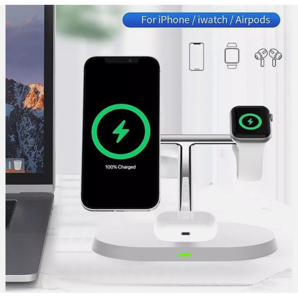 Ein weißer Ladeständer mit einem Telefon, einer Uhr und AirPods, die neben einem Laptop aufgeladen werden.