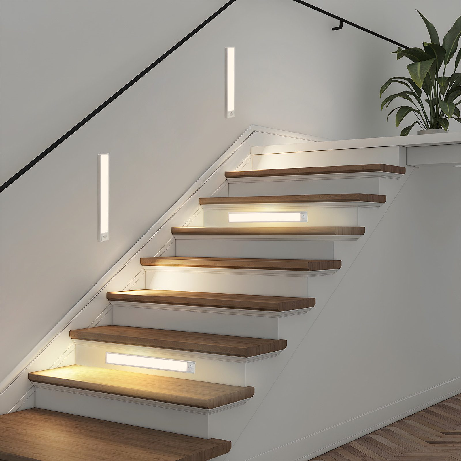 Obraz przedstawia listwy LED zainstalowane na klatce schodowej, zapewniające oświetlenie dla bezpieczeństwa i estetyki.