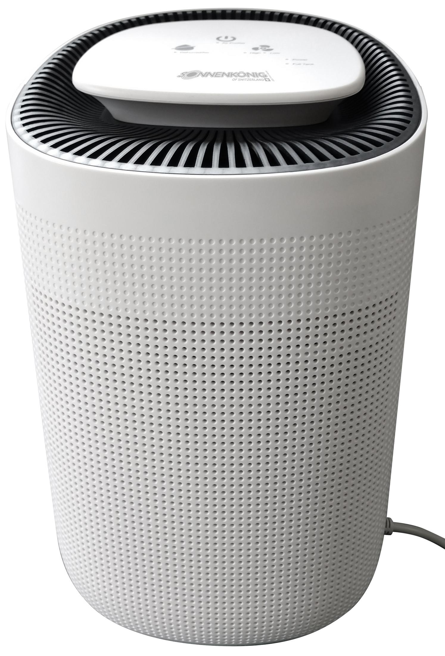 Un purificatore d'aria cilindrico bianco con una superficie perforata e un pannello superiore con comandi.
