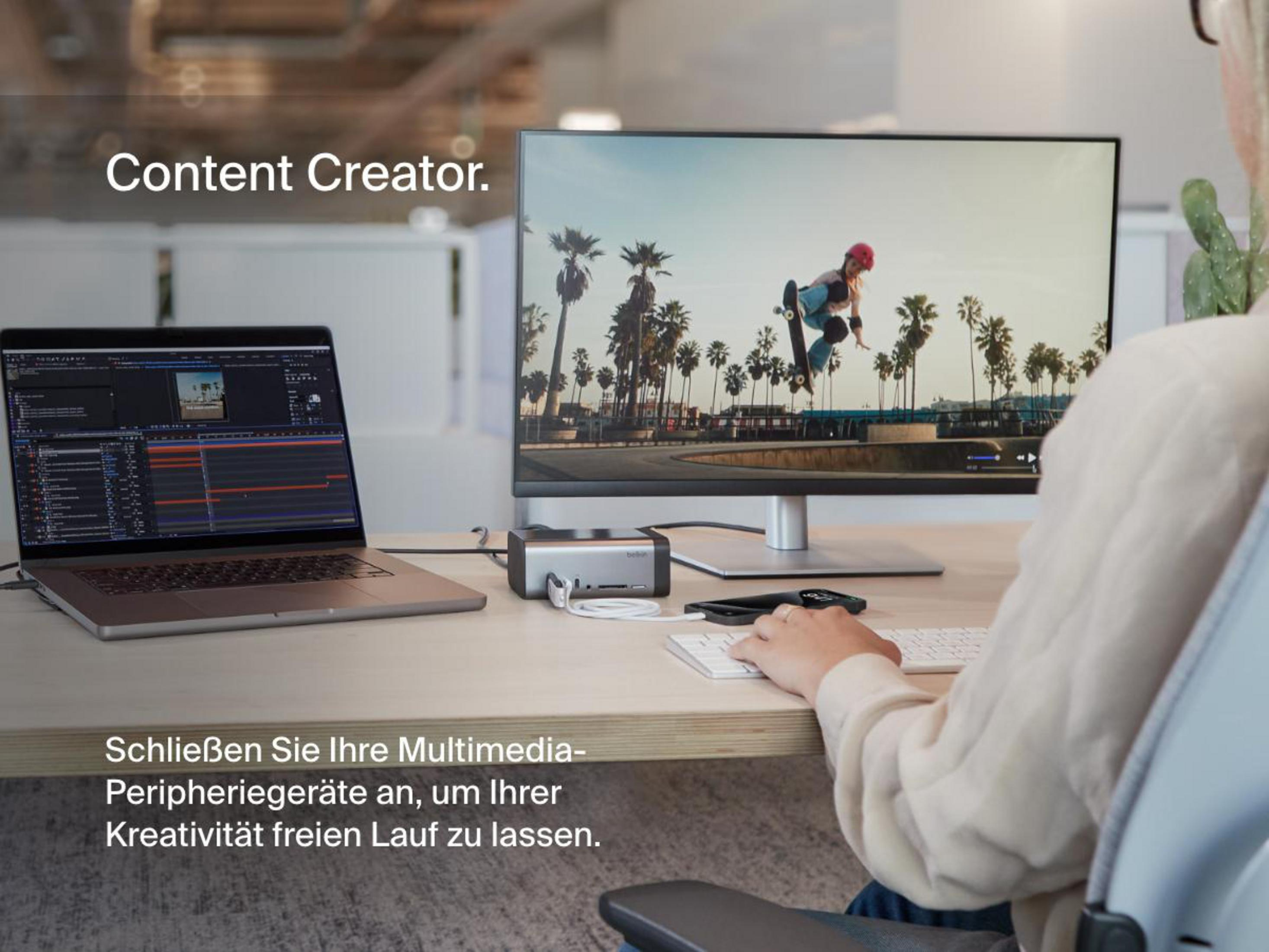 Ein Schreibtisch-Setup mit einem Laptop, Monitor und Belkin Thunderbolt Dock, das die Multimedia-Konnektivität für Content-Ersteller fördert.