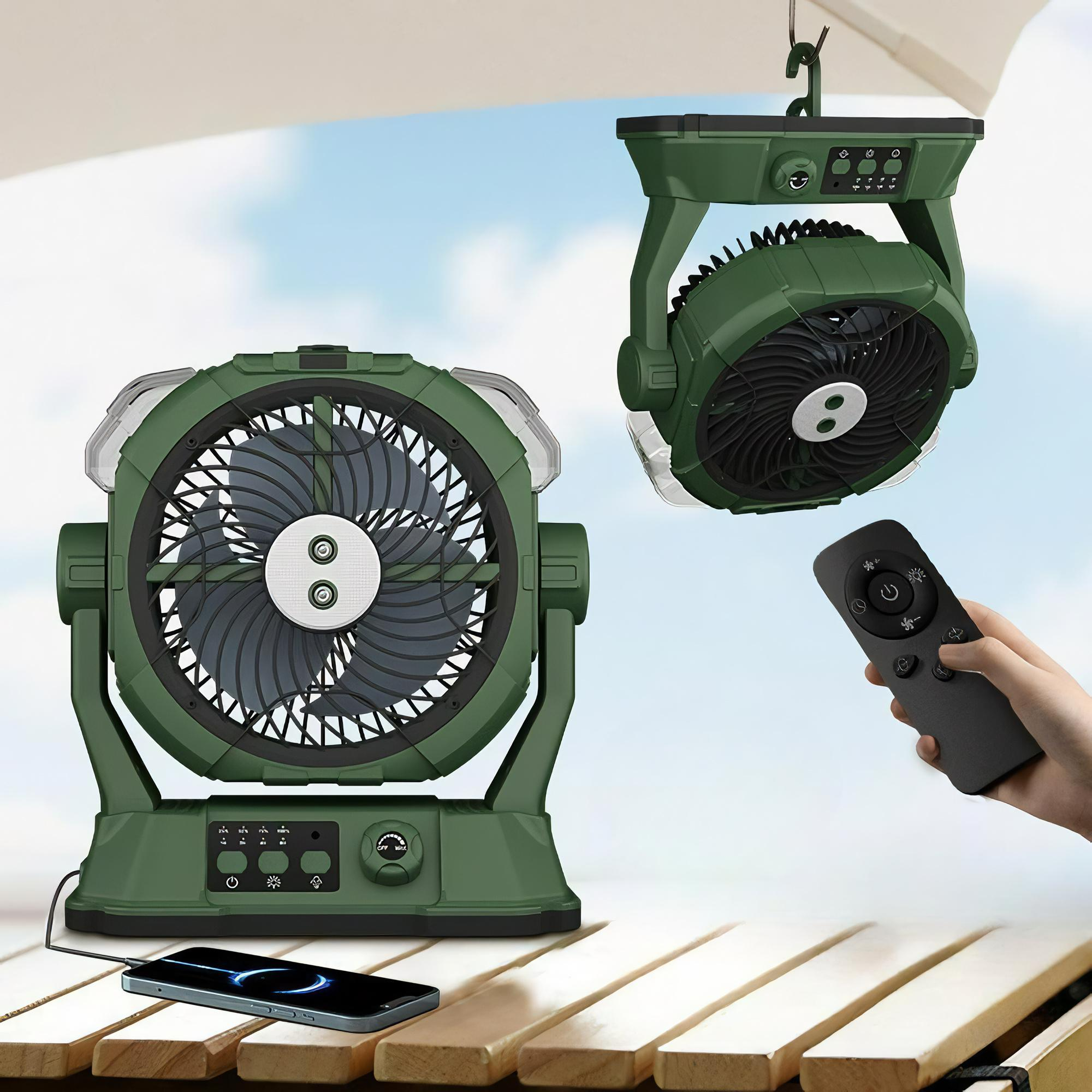 Ein grüner Boxventilator mit LED-Leuchten, einer Fernbedienung und einem Telefon auf einer Holzoberfläche.