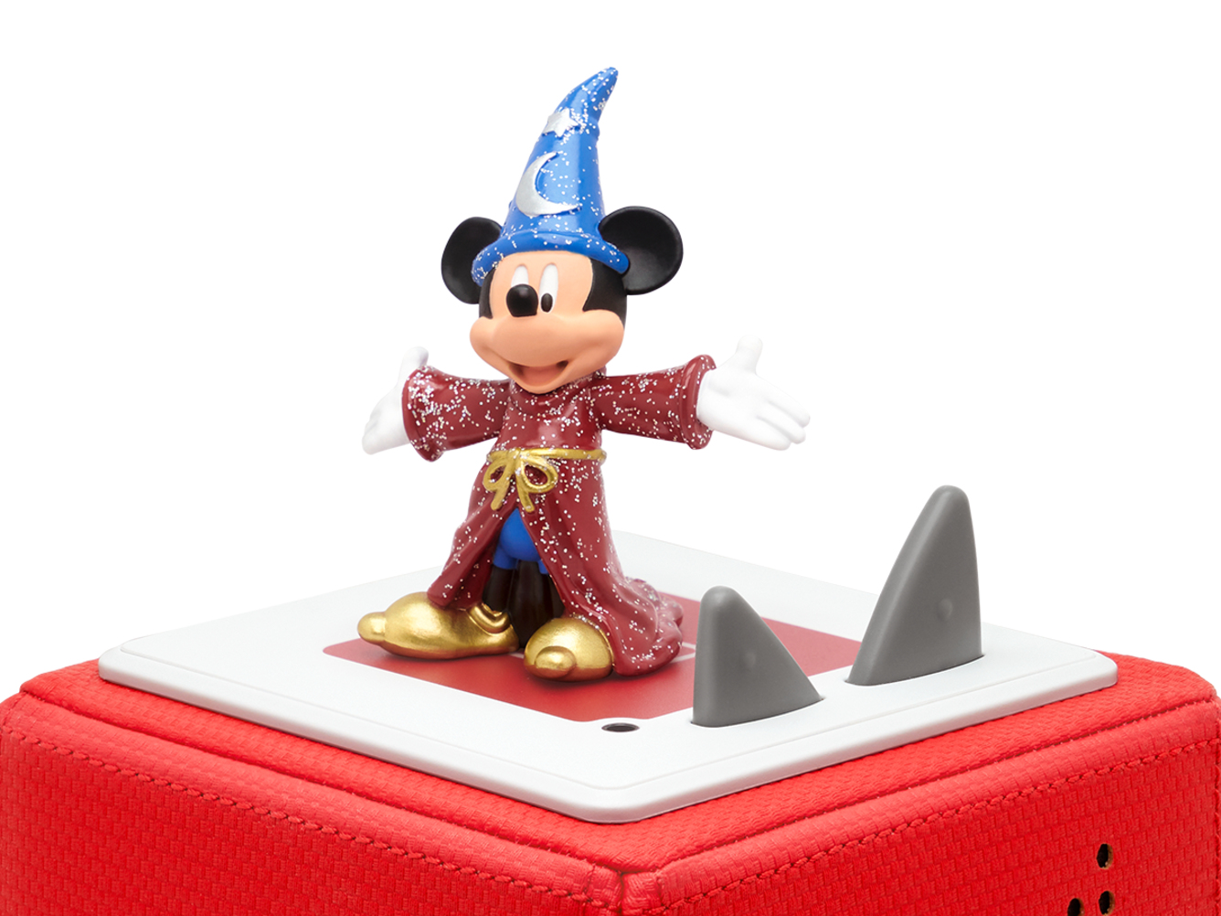 Eine Micky-Maus-Figur auf einem Lautsprecher mit grauen, haifischflossenförmigen Aufsätzen.