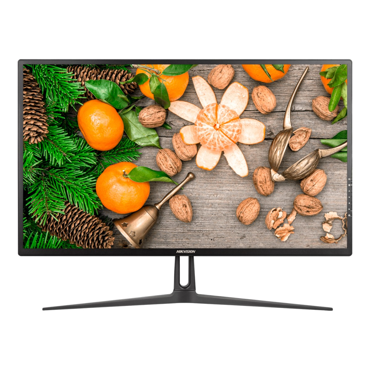 Monitor con fondo de madera, naranjas, nueces y una campana.