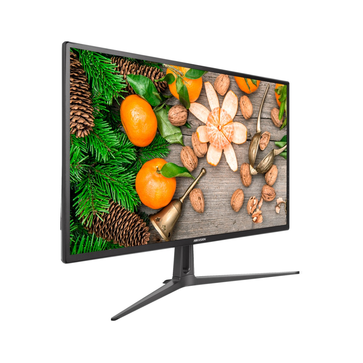 Monitor con fondo de madera, naranjas, nueces y una campana.