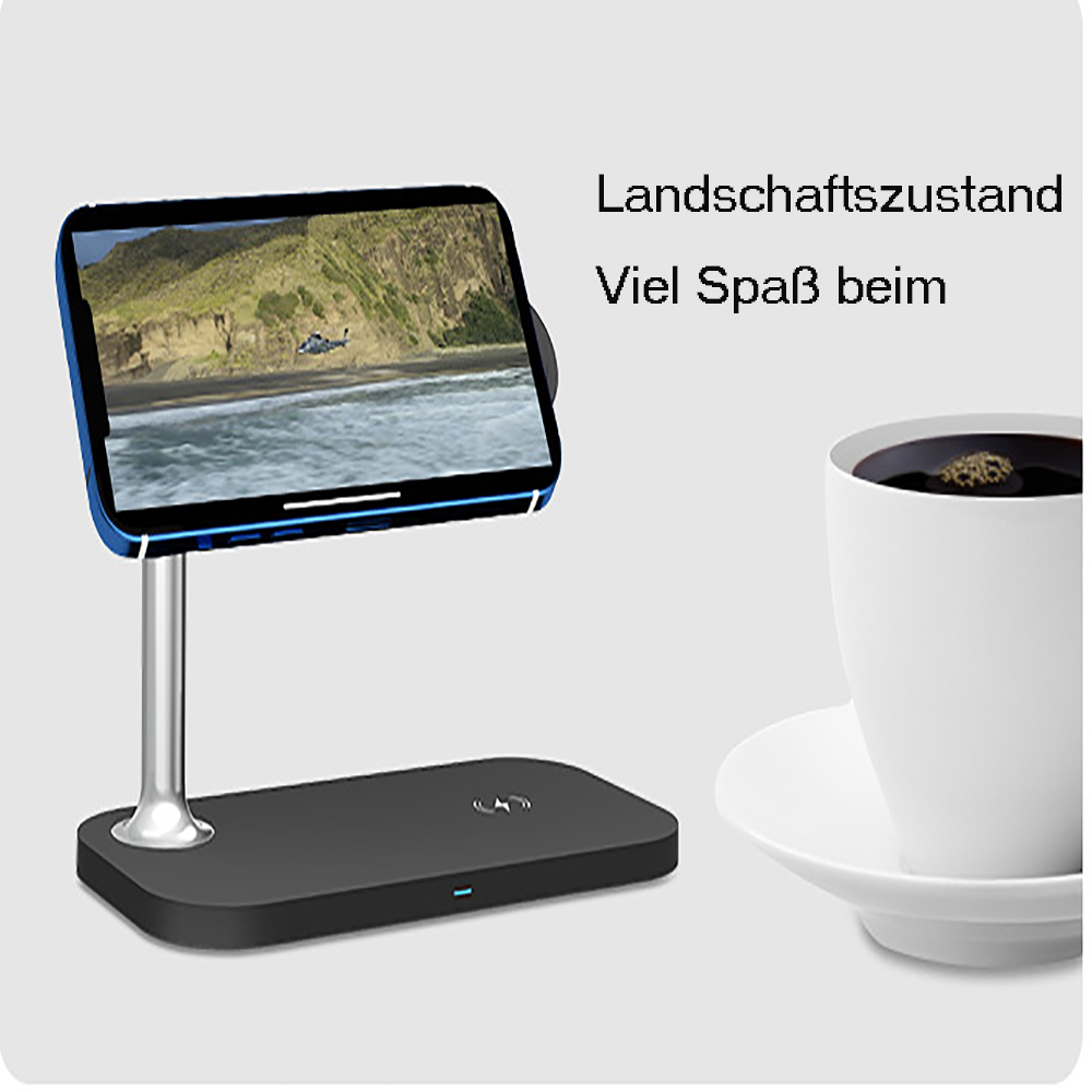 Eine schwarze Ladestation mit einem Telefon, das ein Video abspielt, neben einer weißen Kaffeetasse auf einer Untertasse.